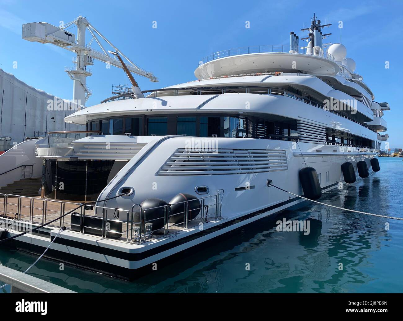 AJAXNETPHOTO. 13TH MAY, 2022. MARINA DI CARRARA, ITALY. - ARABIAN NIGHTS SUPERYACHT - SCHEHERAZADE, ONE OF THE WORLD'S LARGEST LUXURY SUPERYACHTS BUILT BY LURSSEN OF GERMANY AT A COST OF APPROX $700MILLION. THE SHIP IS 459FT (138M) LONG, HAS SIX DECKS, TWO HELIPADS, 4 RADAR INSTALLATIONS AND DECORATED THROUGHOUT WITH GOLD-PLATED AND MARBLE ARTIFACTS. THE SHIP FLIES THE CAYMAN ISLANDS FLAG BUT OWNERSHIP IS CURRENTLY UNKNOWN. VESSEL SEIZED BY ITALIAN AUTHORITIES IN EARLY MAY.PHOTO:AJAX NEWS PHOTOS REF:DTF221305 2887 Stock Photo