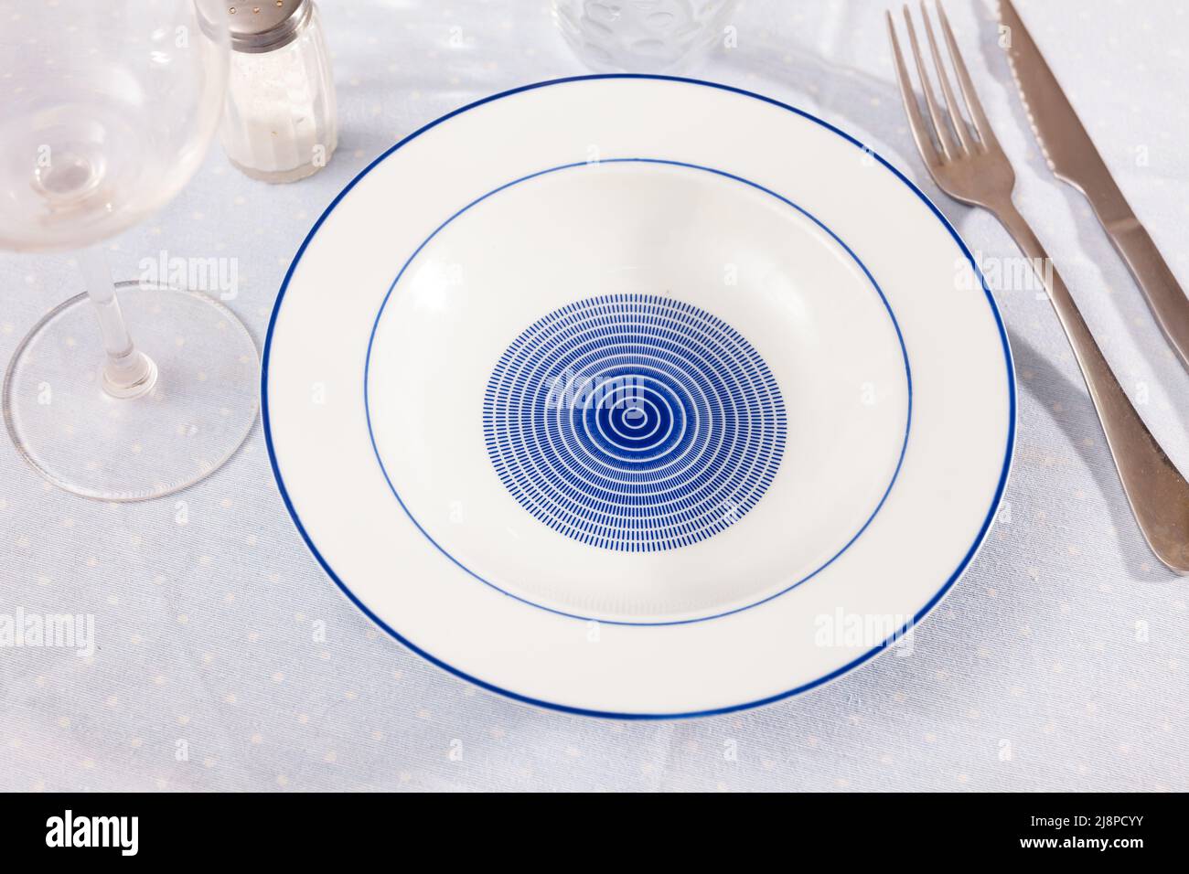 Empty plate with fork and knife Stock Photo - Alamy