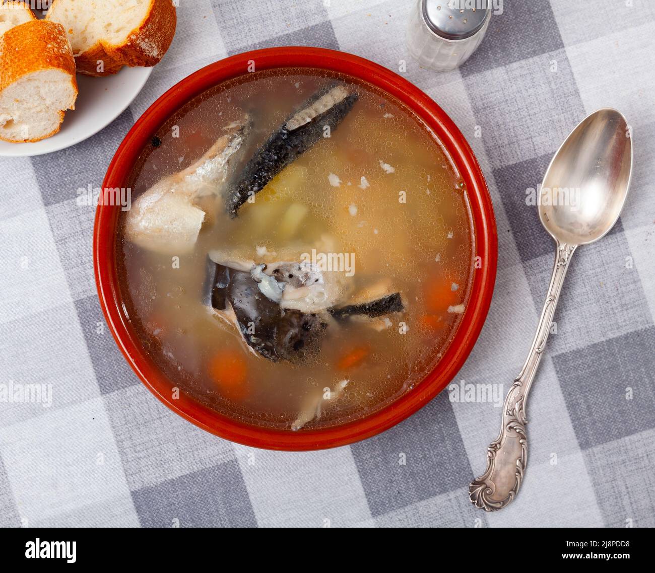 Fish soup with salmon bones and vegetables Stock Photo Alamy