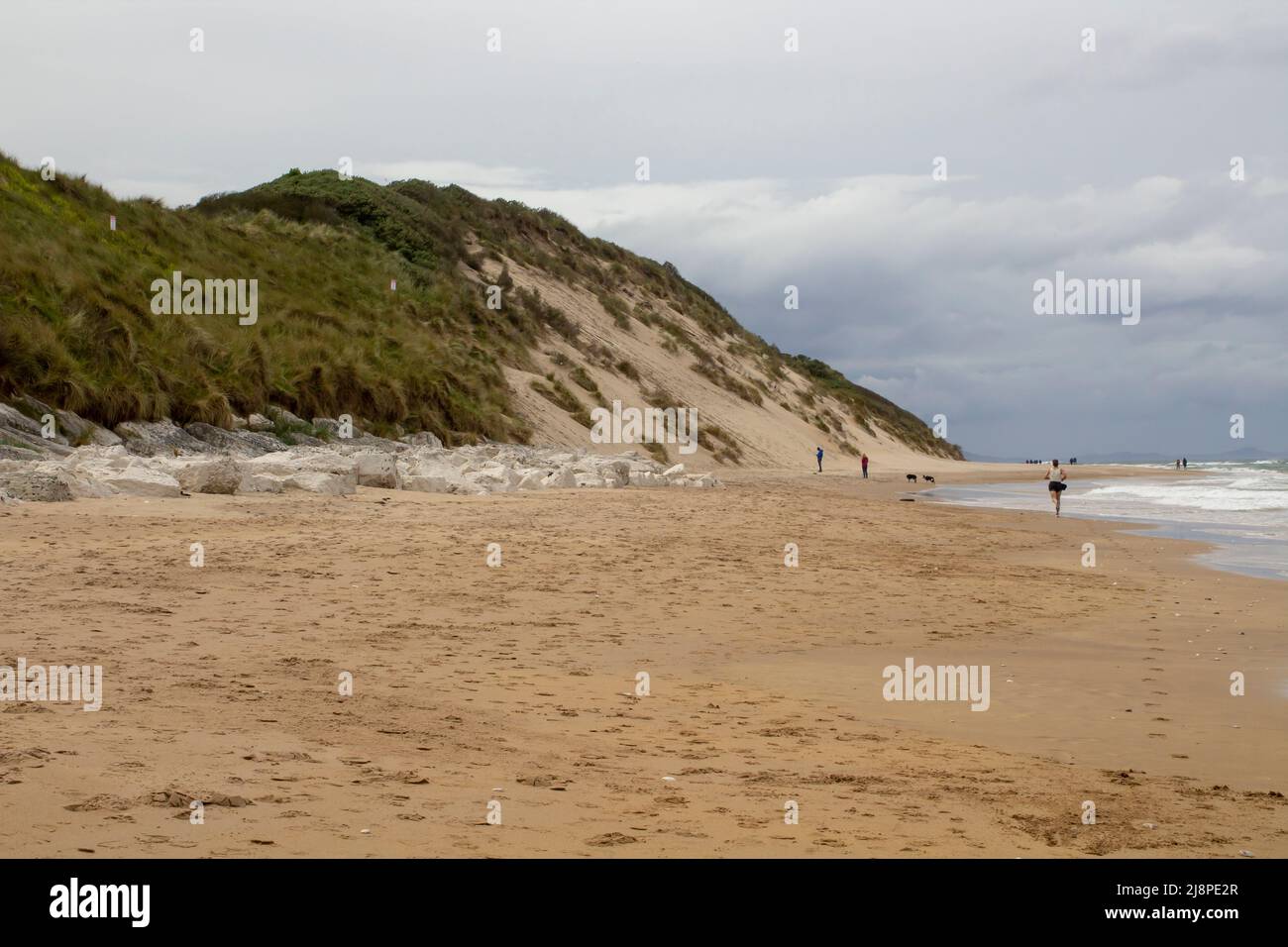 12 May 2022 The beach and shoreline at Port Ballintrae looking Northward on the picturesque North East Causeway Coast of Northern Ireland in County An Stock Photo