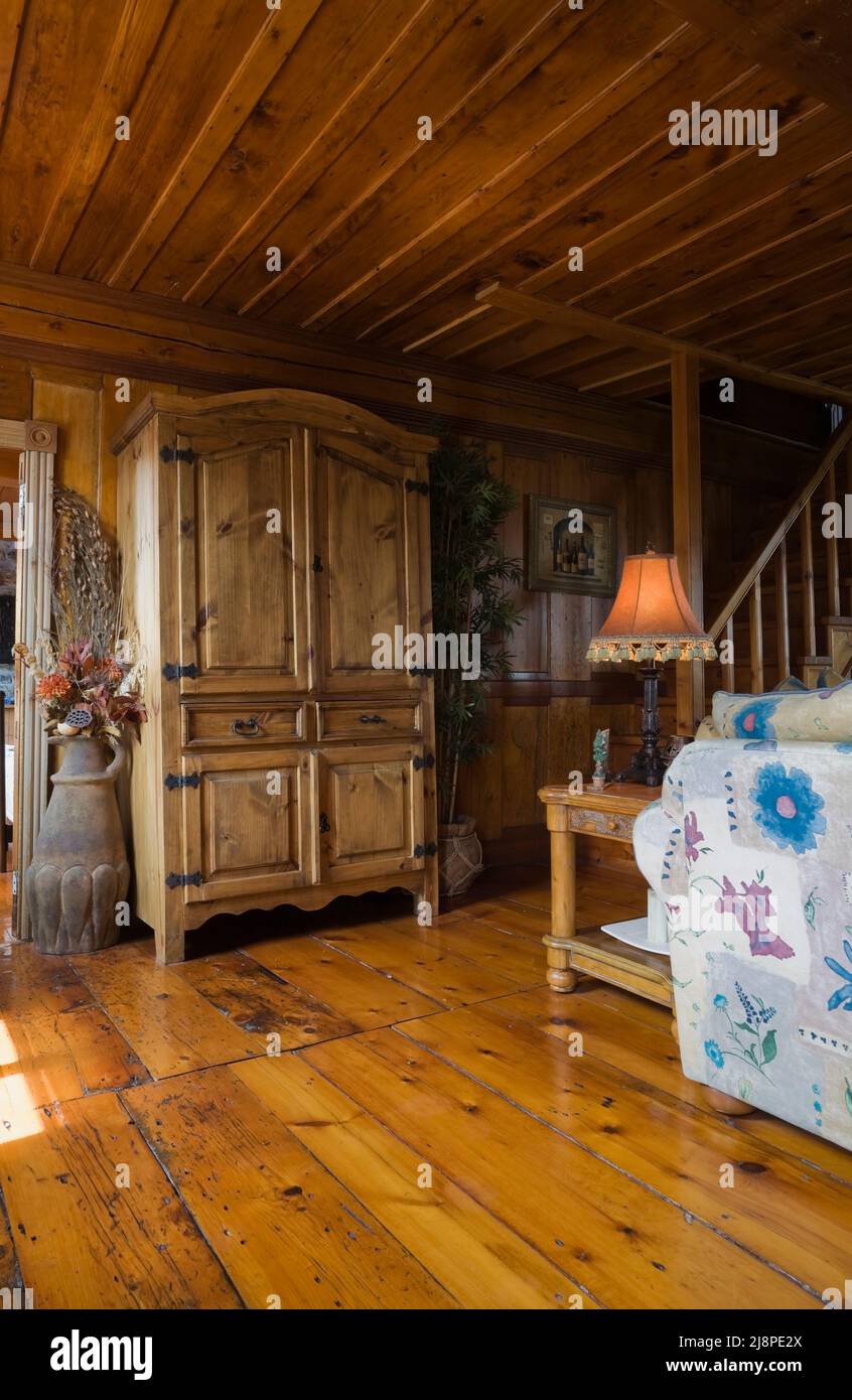 Antique reproduction armoire and furnishings in living room inside old