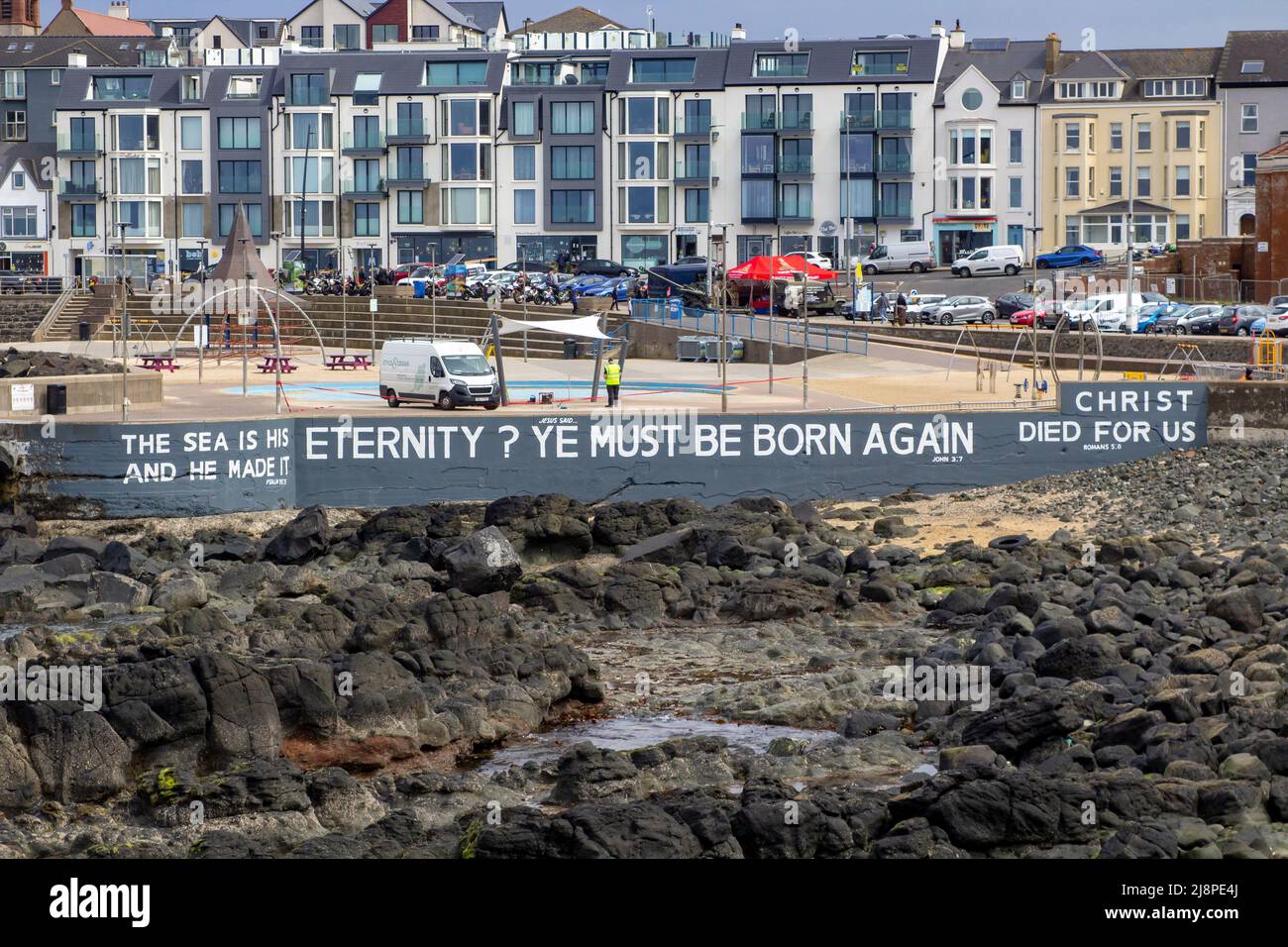 12 May 2022, The seafront and promenade with it's famous Bible Text in the populat tourist centre of Portstewart on the causeway Coast of County londo Stock Photo