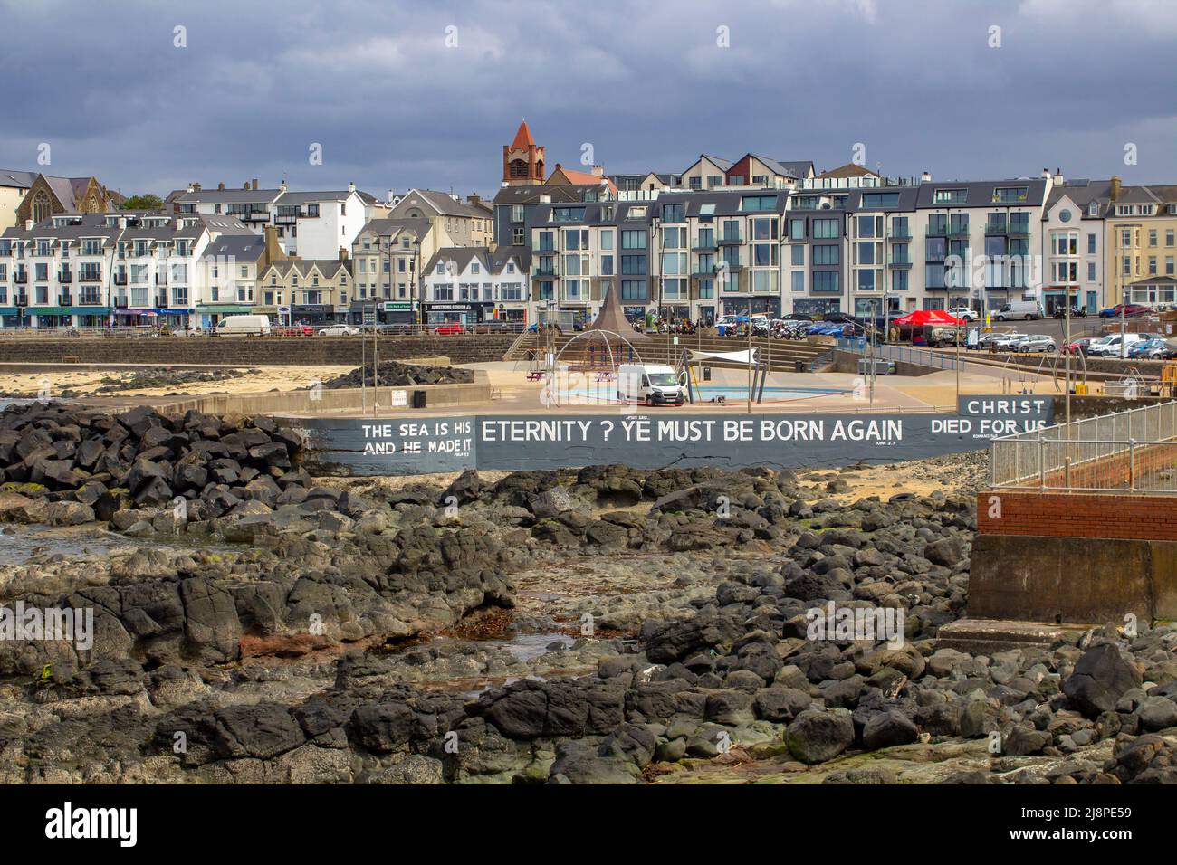12 May 2022, The seafront and promenade with it's famous Bible Text in the populat tourist centre of Portstewart on the causeway Coast of County londo Stock Photo