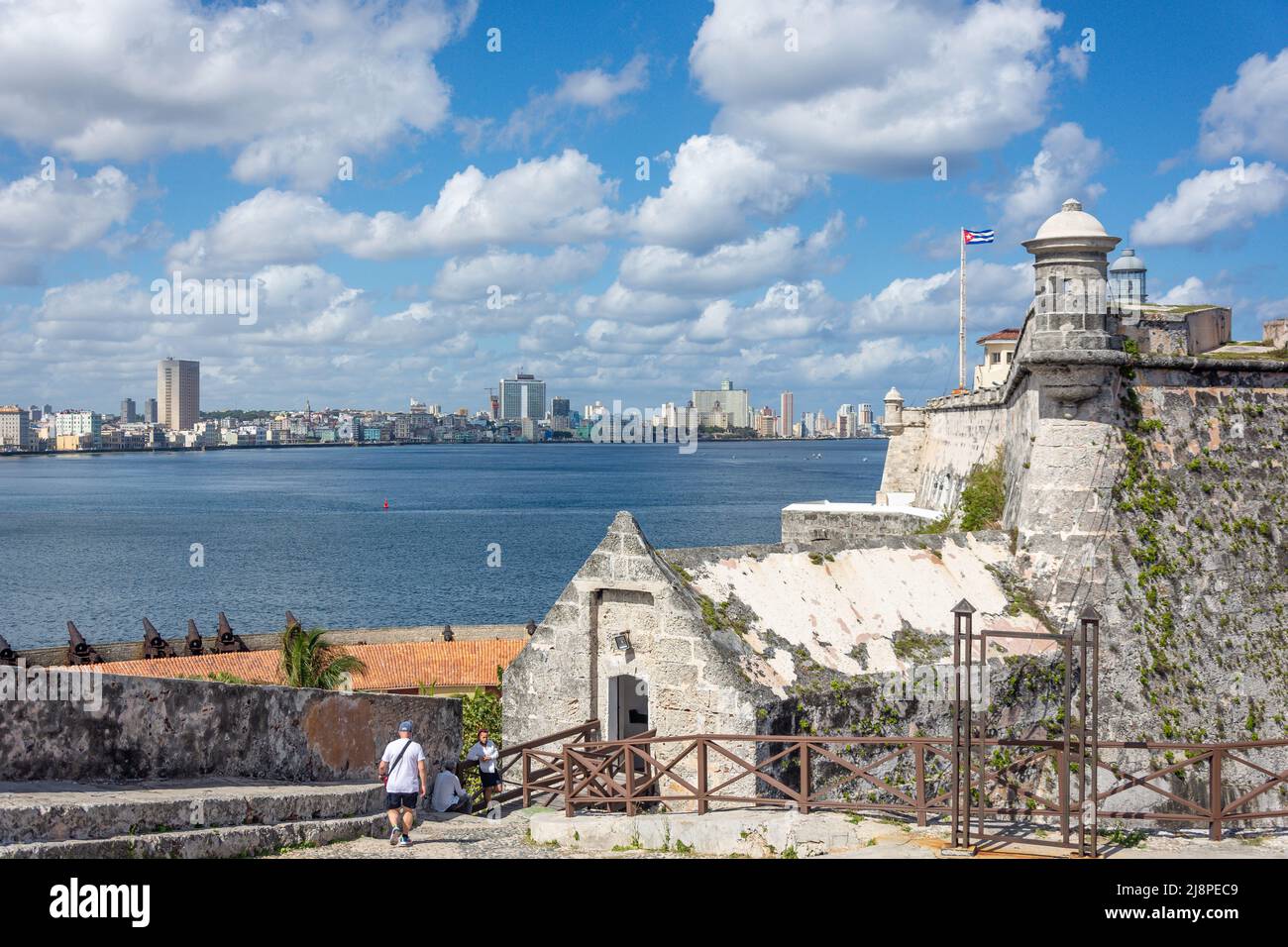 Cuba, Havana. Fortress wall and Cuban flag at San Carlos de