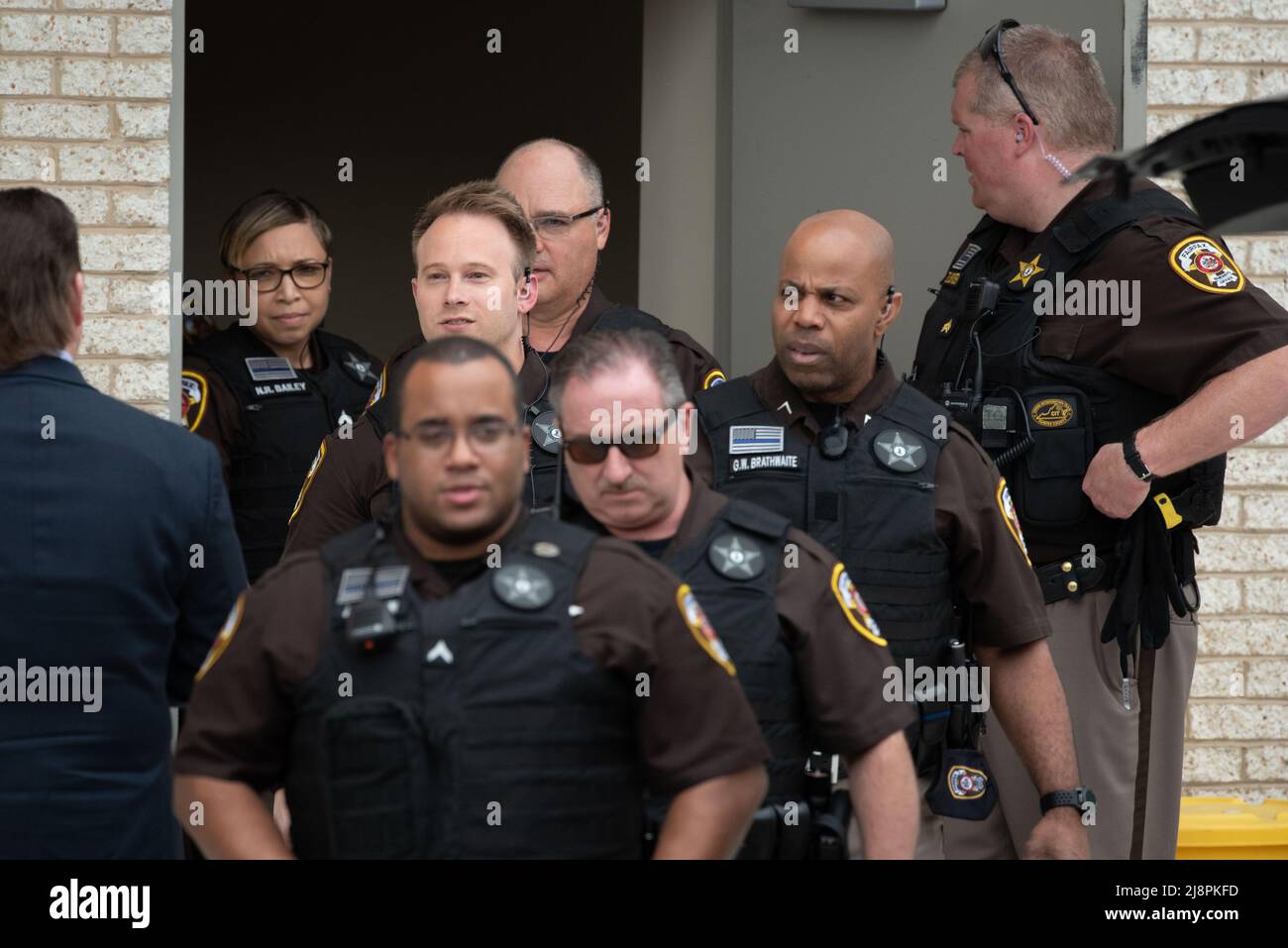 Fairfax County Sheriff's Deputies exit the courthouse to provide crowd control for Johnny Depp and Amber Hearts departure from the Fairfax County Courthouse, in Fairfax, at the close of another day in his civil trial with Amber Heard, Thursday, May 5, 2022. Depp brought a defamation lawsuit against his former wife, actress Amber Heard, after she wrote an op-ed in The Washington Post in 2018 that, without naming Depp, accused him of domestic abuse.Credit: Cliff Owen/CNP/Sipa USA (RESTRICTION: NO New York or New Jersey Newspapers or newspapers within a 75 mile radius of New York City) Stock Photo