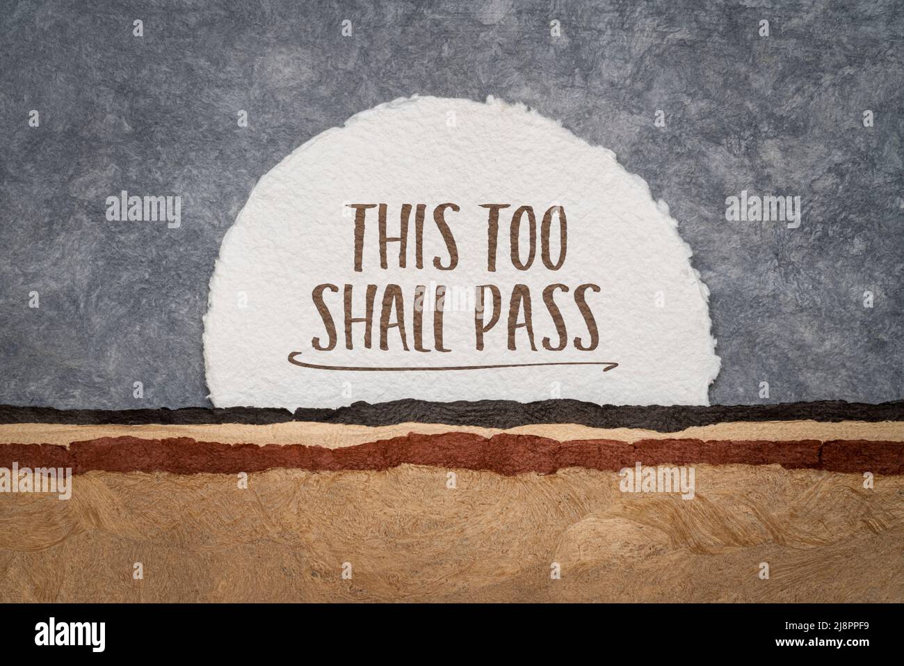 this too shall pass - inspirational handwriting on a handmade abstract paper landscape, positivity, hope, temporary nature, or ephemerality of the hum Stock Photo