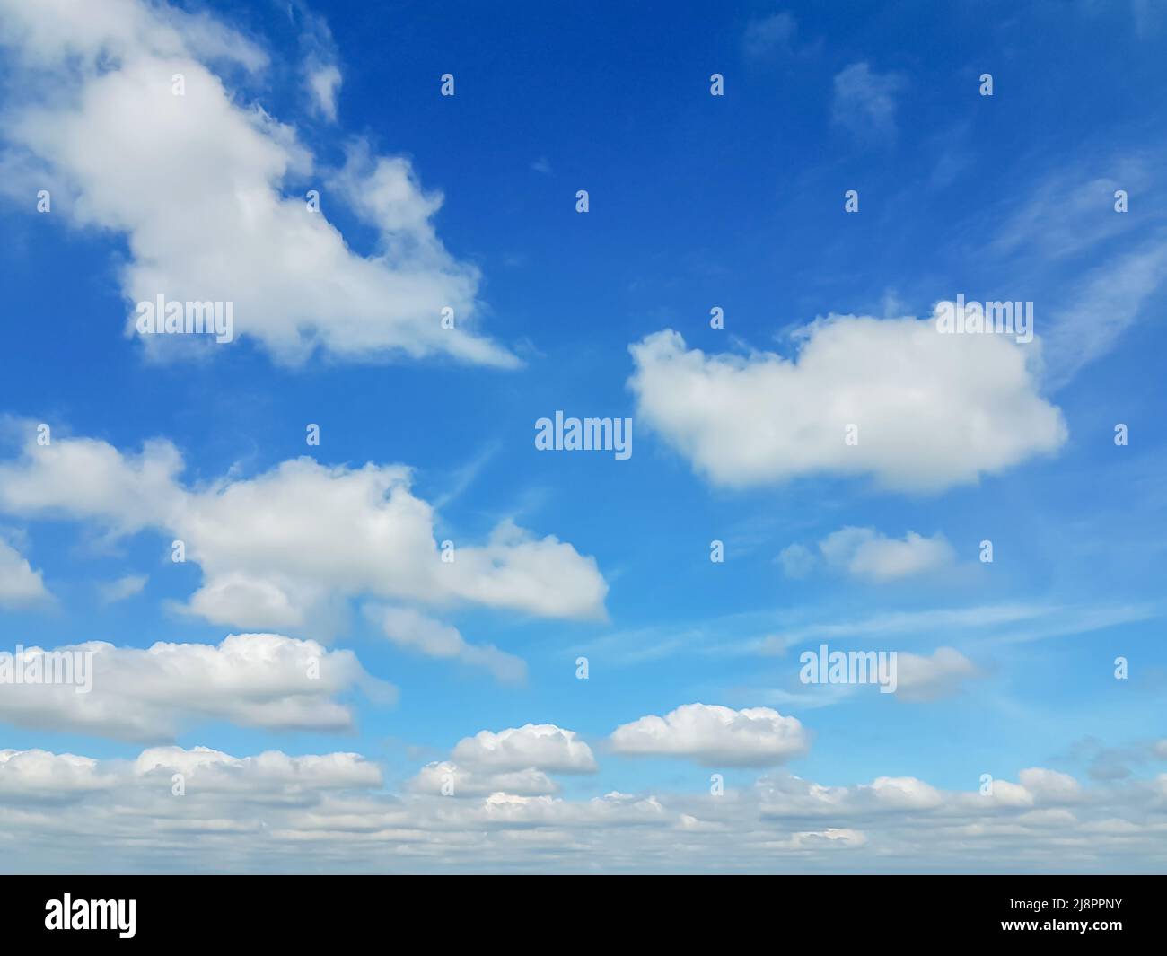 Beautiful blue sky with white fluffy clouds Stock Photo - Alamy