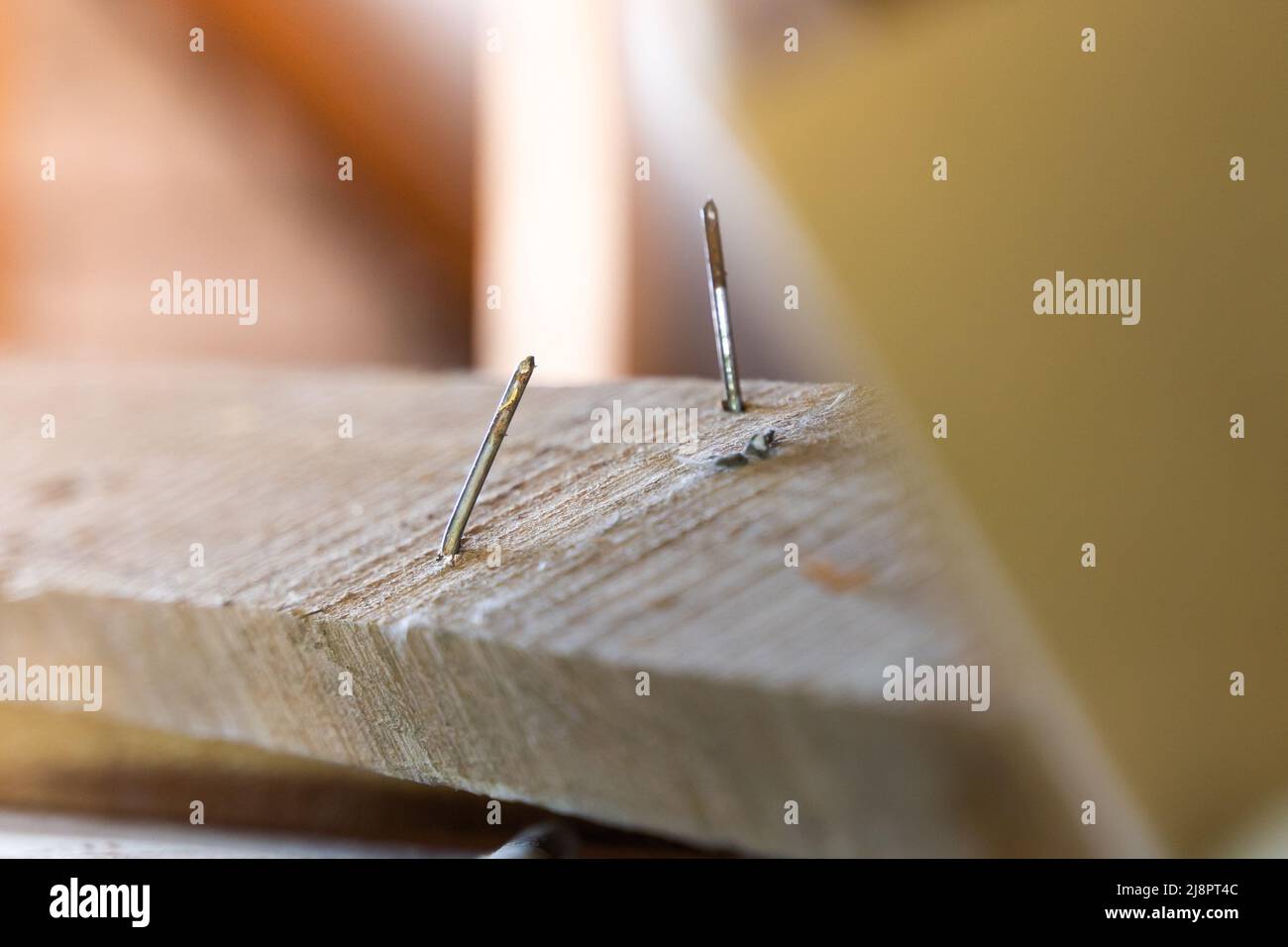 Two nails into a board hi-res stock photography and images - Alamy