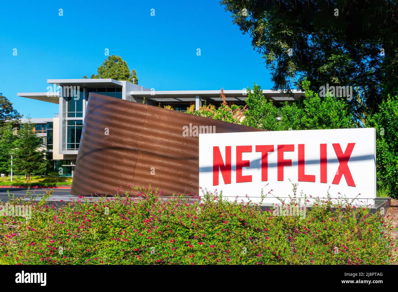 Netflix logo, sign at the entrance to the Netflix headquarters in Silicon Valley. - Los Gatos, California, USA - 2022 Stock Photo
