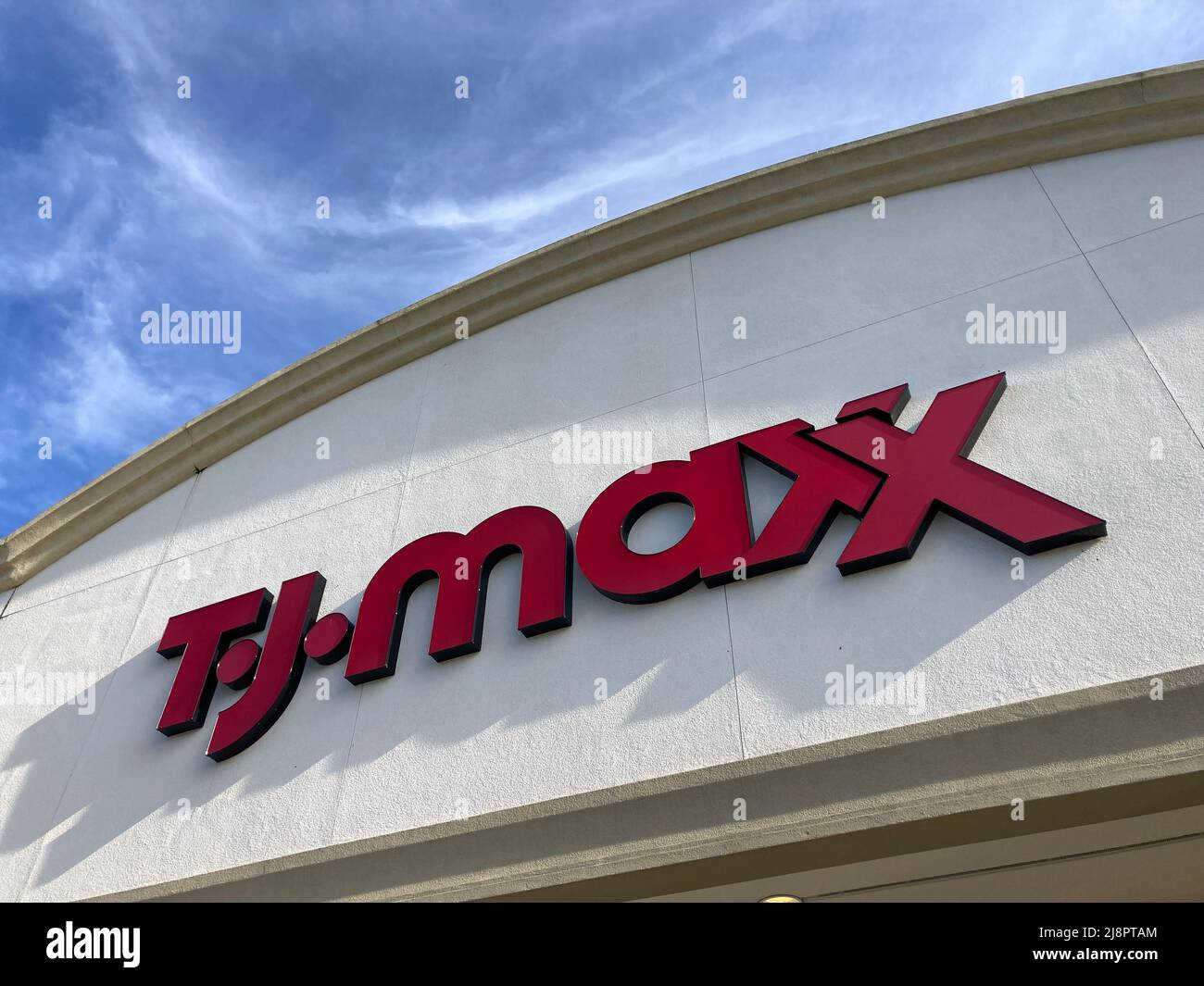 Looking up at TJ Maxx department store logo. TJ Maxx is an American department store chain is one of the largest clothing retailers in the United Stat Stock Photo