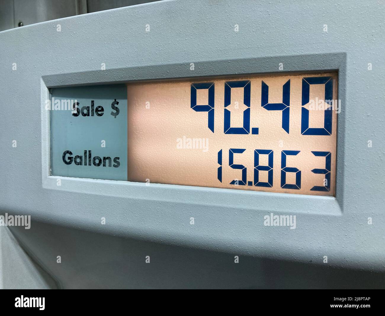 High gas prices. Close up pump displaying 90 dollars paid for a tank of gas. The average price of a gallon of regular gasoline in the United States ro Stock Photo