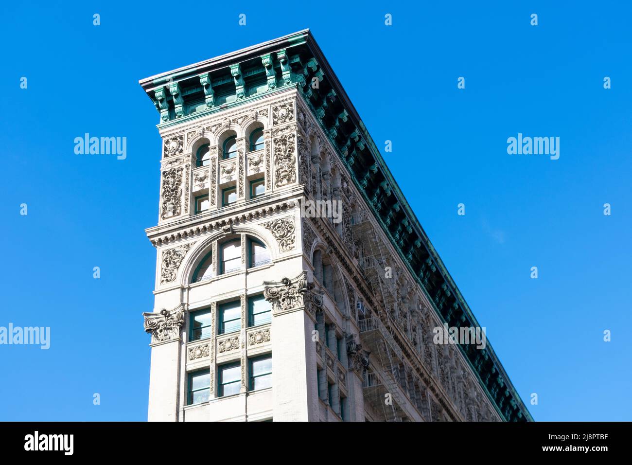 Exterior view of The Silk Exchange Building with ornamental facade and fire escapes located at 451 Broome Street - New York, USA - 2022 Stock Photo