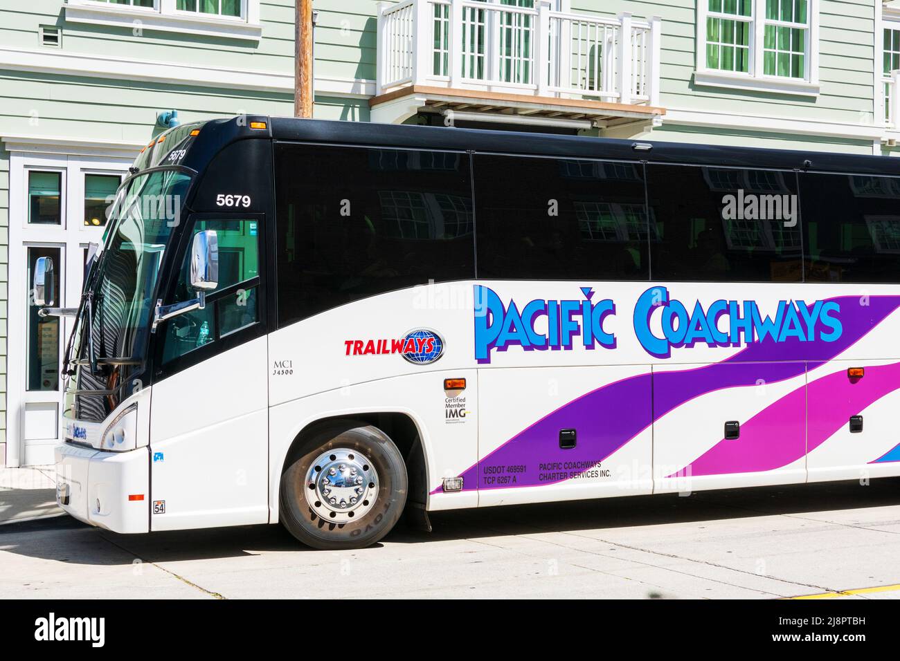Pacific Coachways tour bus parked on the street - Monterey, California, USA - April, 2022 Stock Photo