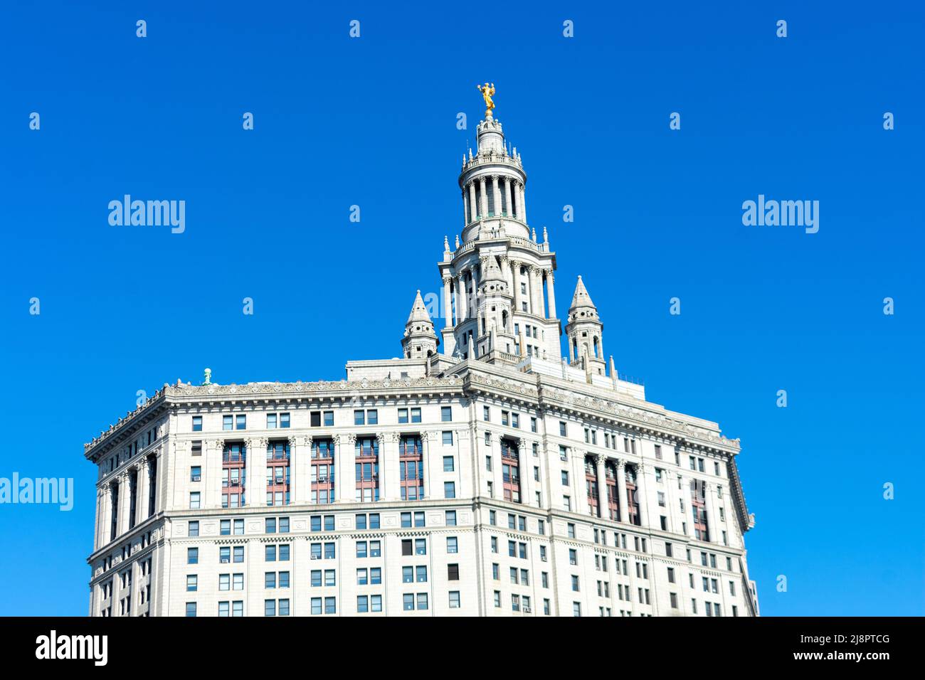 David N. Dinkins Manhattan Municipal Building rear view from the Brooklyn Bridge. Blue sky. - New York, USA - 2022 Stock Photo