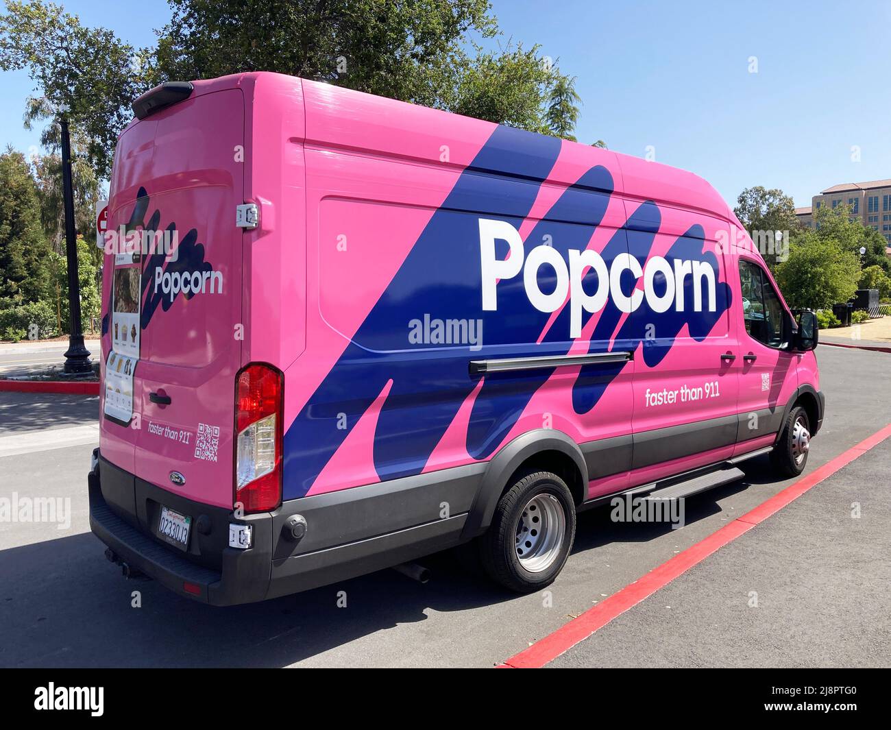 Popcorn delivery van parked at a customer location. Side view - Palo Alto, California, USA - 2022 Stock Photo
