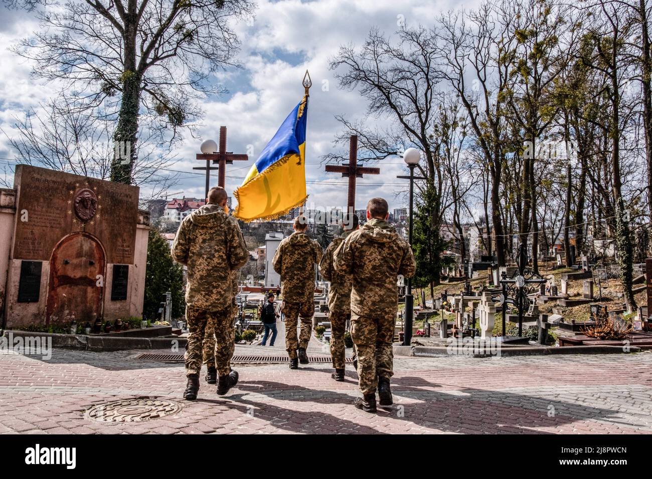 Lviv, Ukraine. 4th Apr, 2022. Soldiers carrying crosses for the coffins of the two soldiers killed by the Russian army at Lviv cemetery. Lviv military funeral.Russia invaded Ukraine on 24 February 2022, triggering the largest military attack in Europe since World War II. (Credit Image: © Rick Mave/SOPA Images via ZUMA Press Wire) Stock Photo