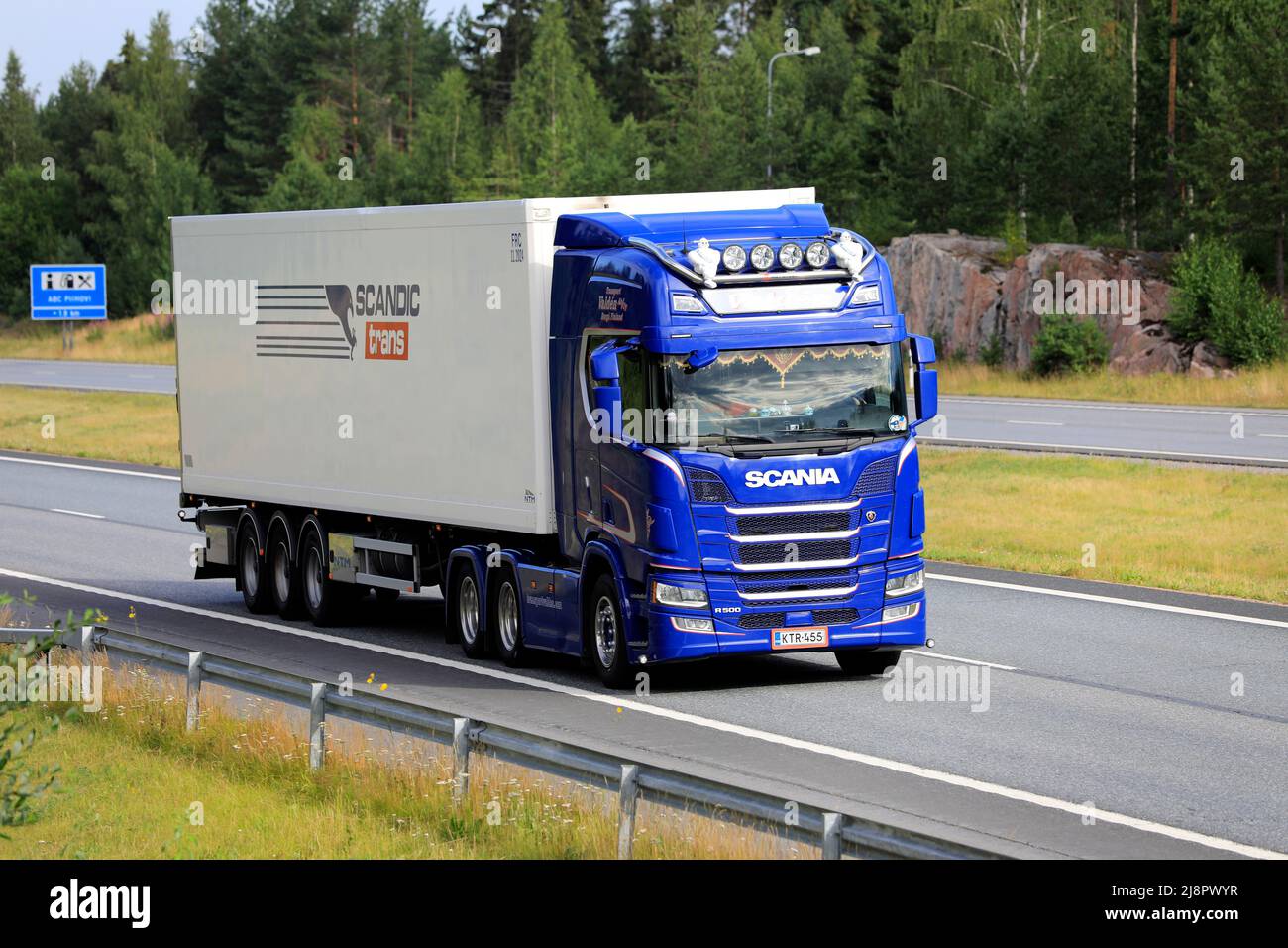 Blue Scania R500 truck semi FRC trailer for Scandic Trans temperature controlled transport hauls load along highway. Salo, Finland. July 9, 2021. Stock Photo