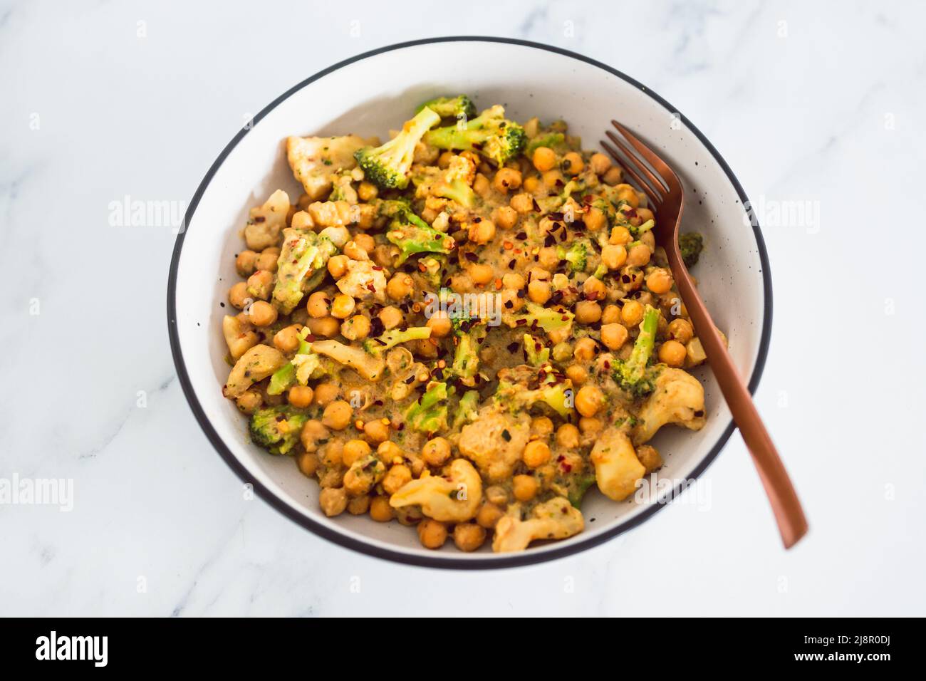 vegan spicy chickpeas broccoli and cauliflower stirfry with peanut