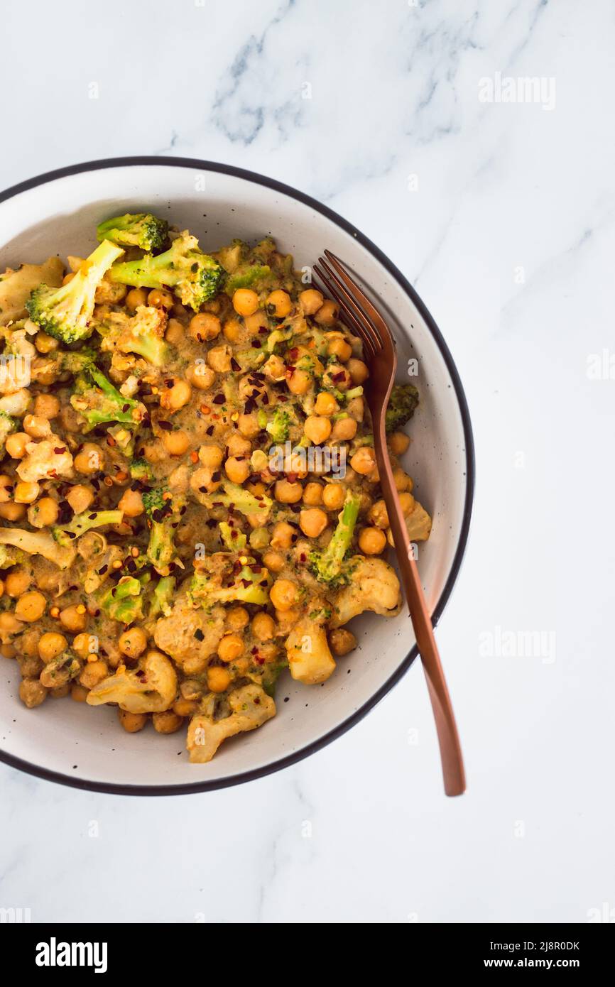 vegan spicy chickpeas broccoli and cauliflower stirfry with peanut
