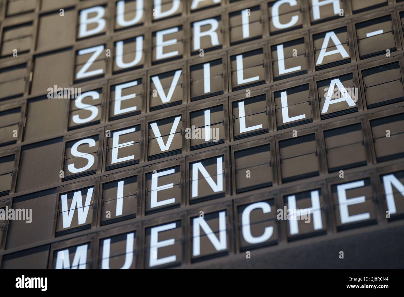 18 May 2022, Hessen, Frankfurt/Main: Numerous charter flights to Seville are announced on the display board at Frankfurt Airport this morning. Around 50,000 Eintracht supporters are expected to attend the Europa League final between Eintracht Frankfurt and Glasgow Rangers in Seville, although the ticket quota for the club is only 10,000. Photo: Frank Rumpenhorst/dpa Stock Photo
