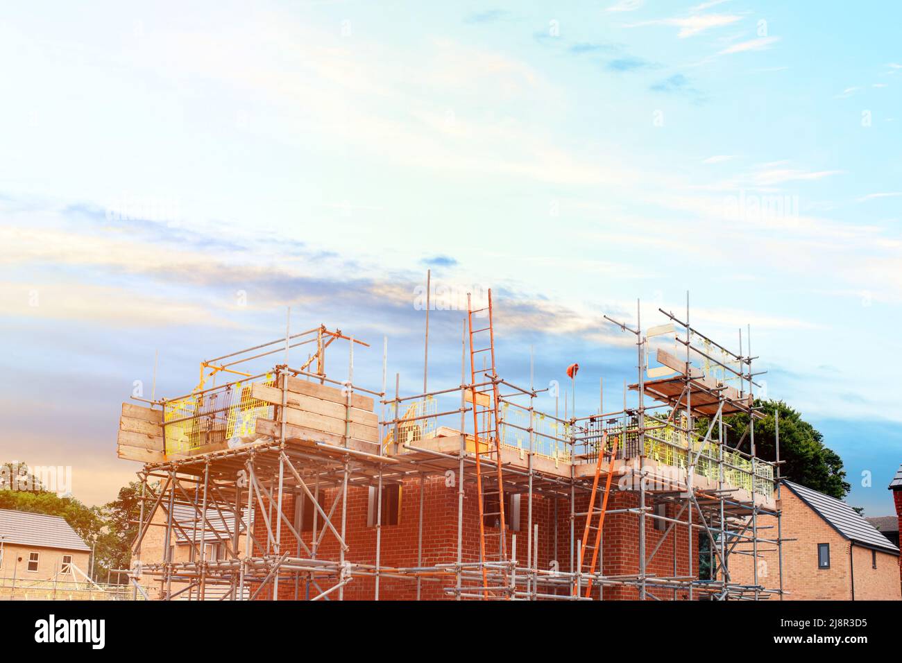 Scaffolding erected around houses in a new housing development Stock