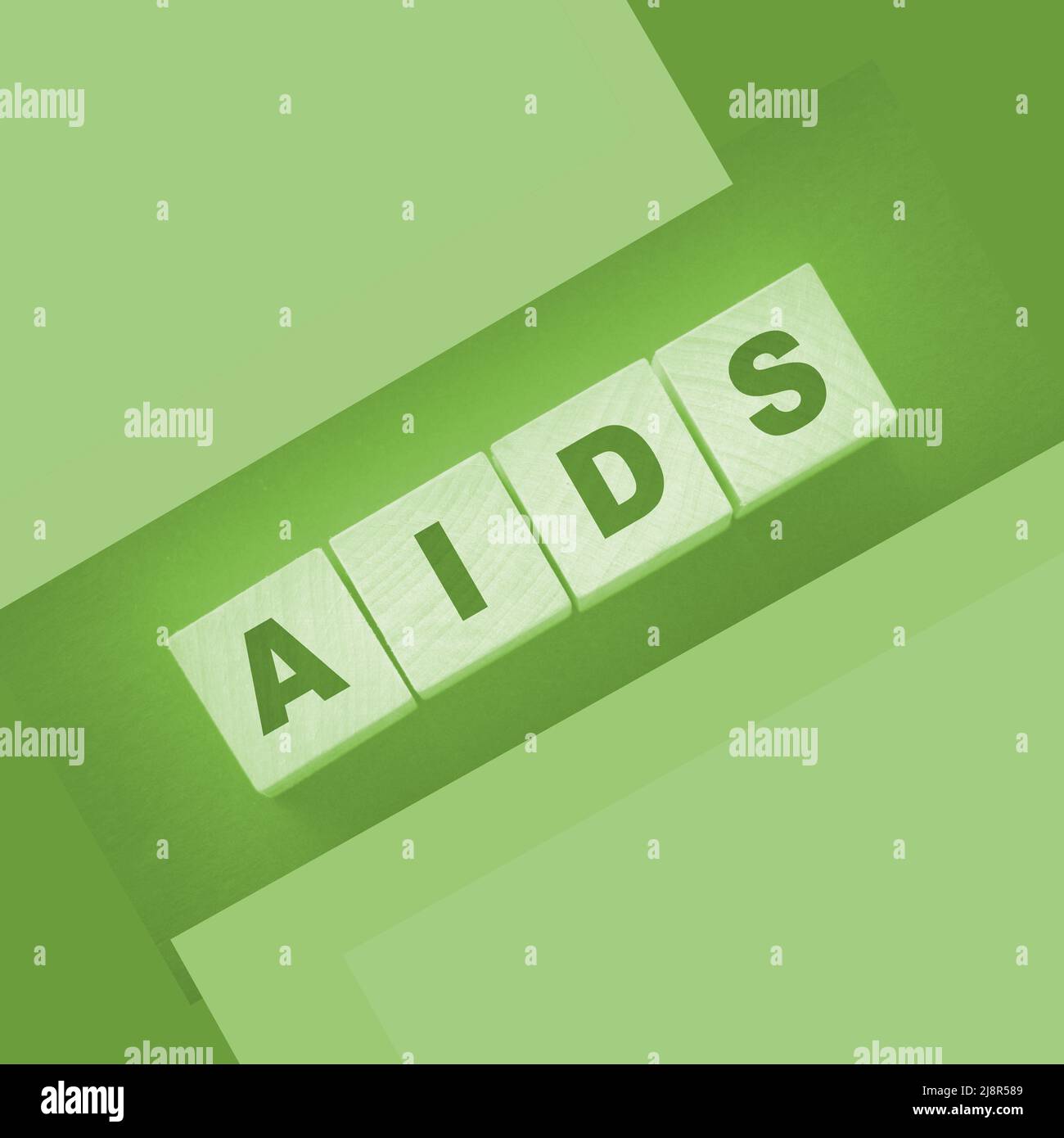 AIDS abbreviation written on wooden cubes. Healthcare concept. STD ...