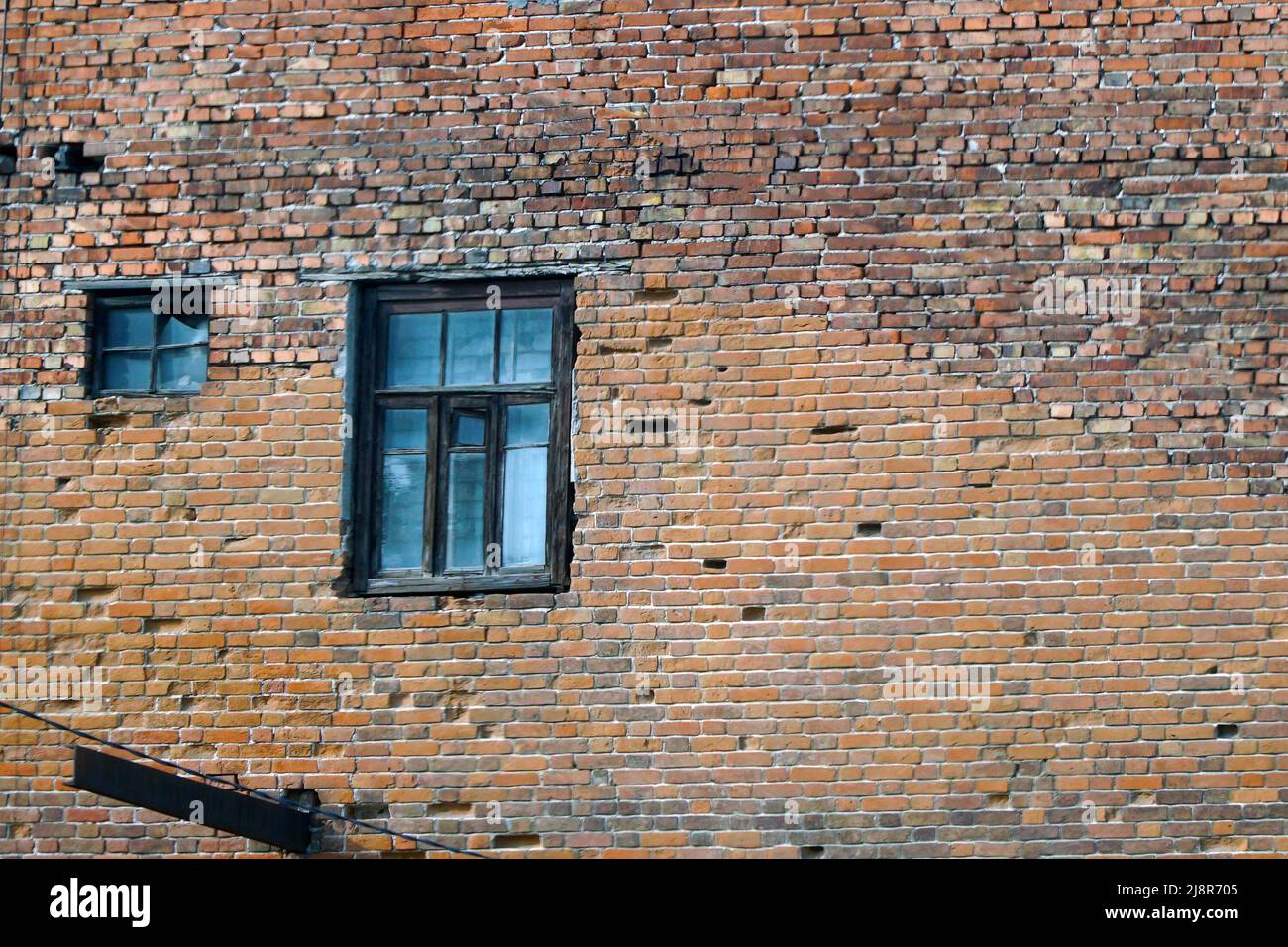 An abandoned old window in a dirty red brick wall Stock Photo - Alamy