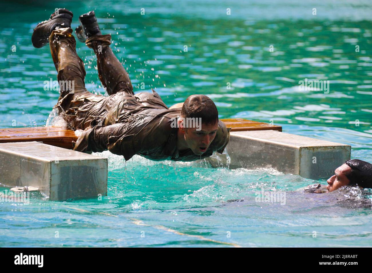 French Polynesia. 11th May, 2022. U.S. Army soldiers from the 100th Battalion, 442nd Infantry Regiment conducts a water obstacle course with French soldiers at Camp Papeari Tahiti, French Polynesia, May 11, 2022, during Marara 22. Marara 22 is a multinational training exercise which enhances combined interoperability between the U.S. military and France's Combined Joint Task Force Headquarters in French Polynesia. Through exercises and engagements, improve our ability to work together with our allies and partners and build on our collective strengths. (Credit Image: © U.S. Army/ZUMA Press Wi Stock Photo