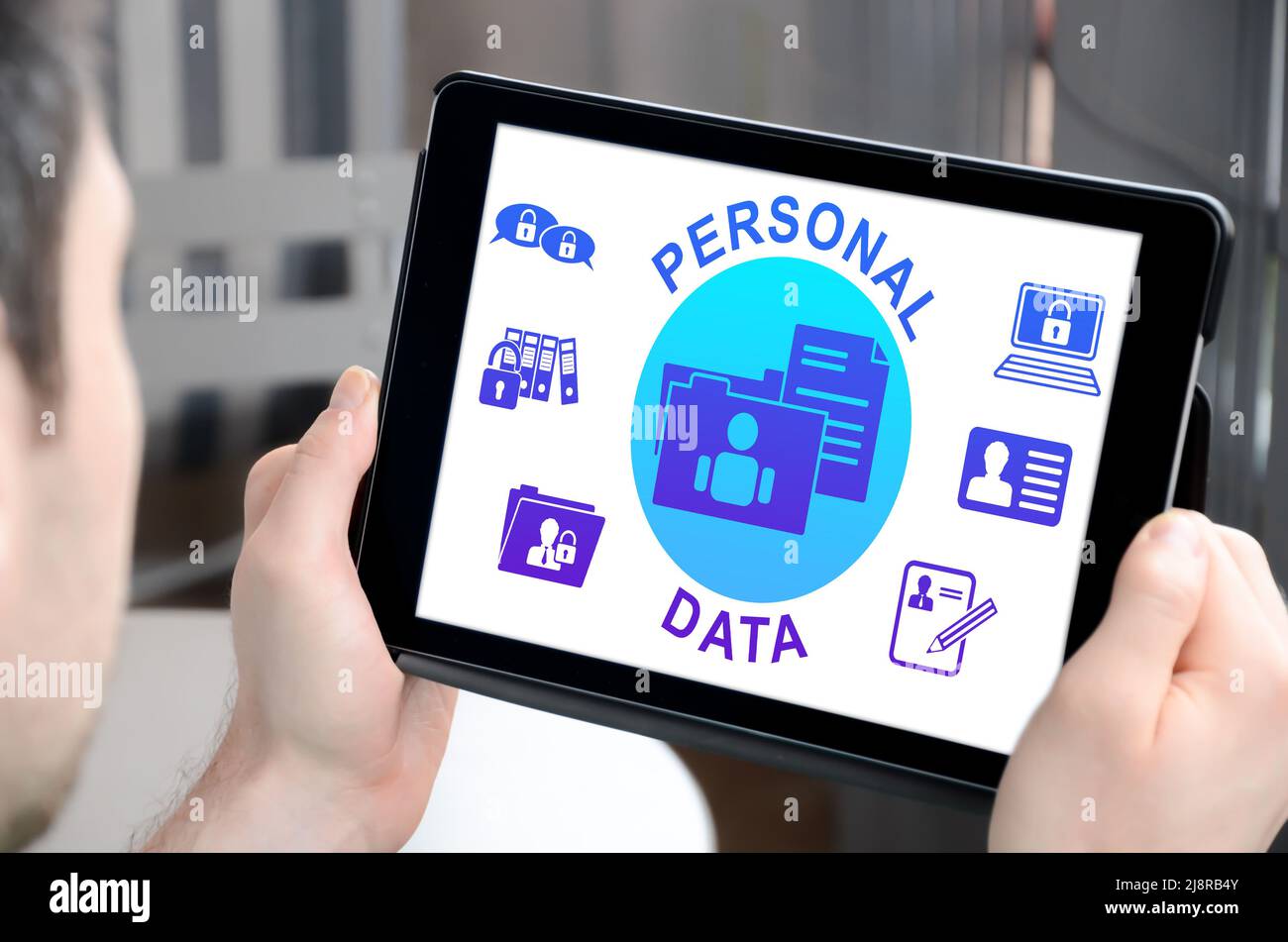 Man holding a tablet showing personal data concept Stock Photo - Alamy