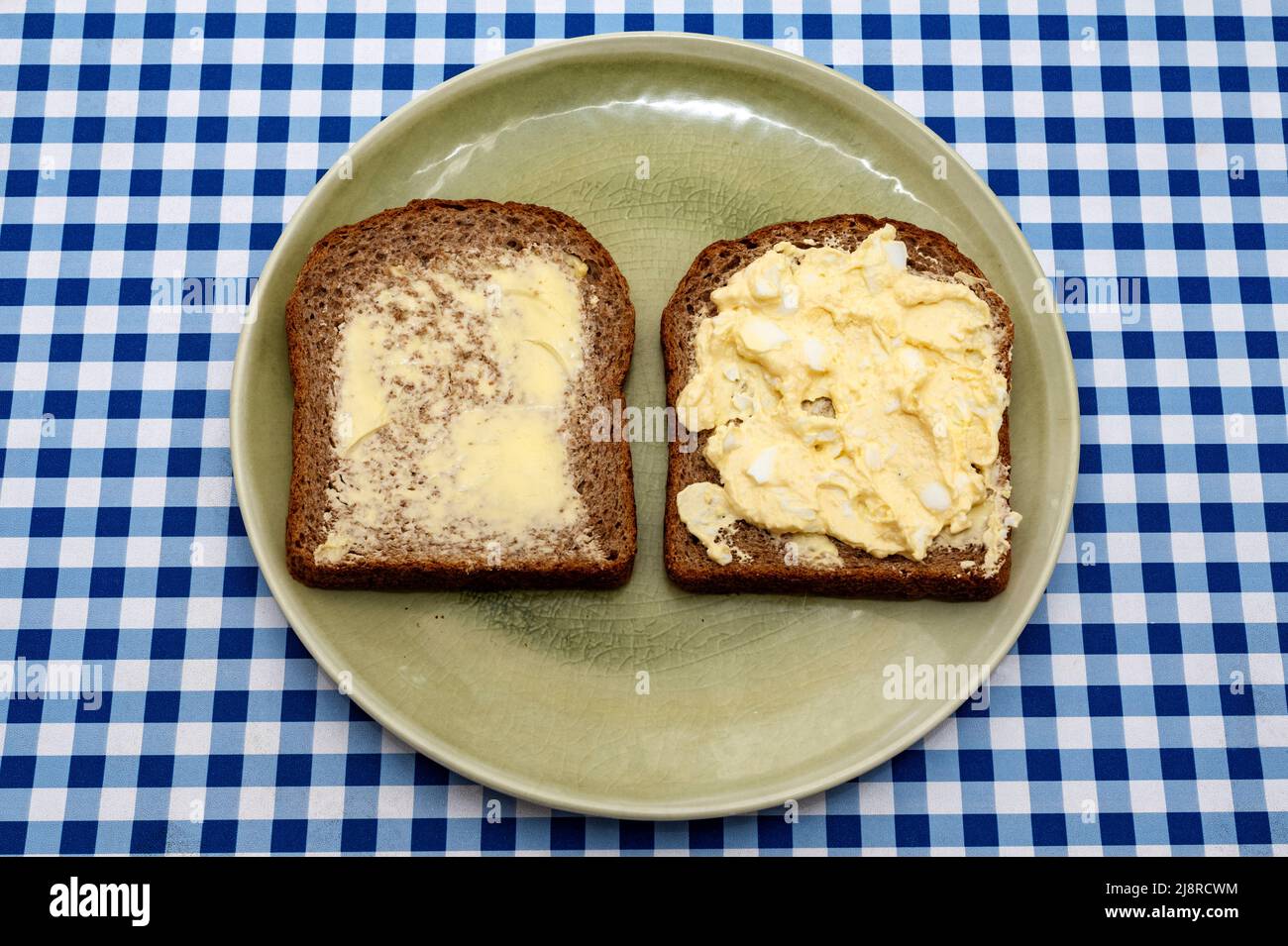 Egg mayonnaise on wholemeal sliced bread and butter Stock Photo