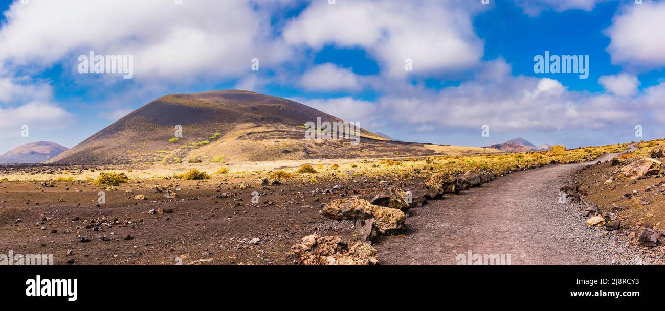 Panorama of Montana Negra and Volcan El Cuervo, Los Volcanes Natural Park, Lanzarote, Spain Stock Photo
