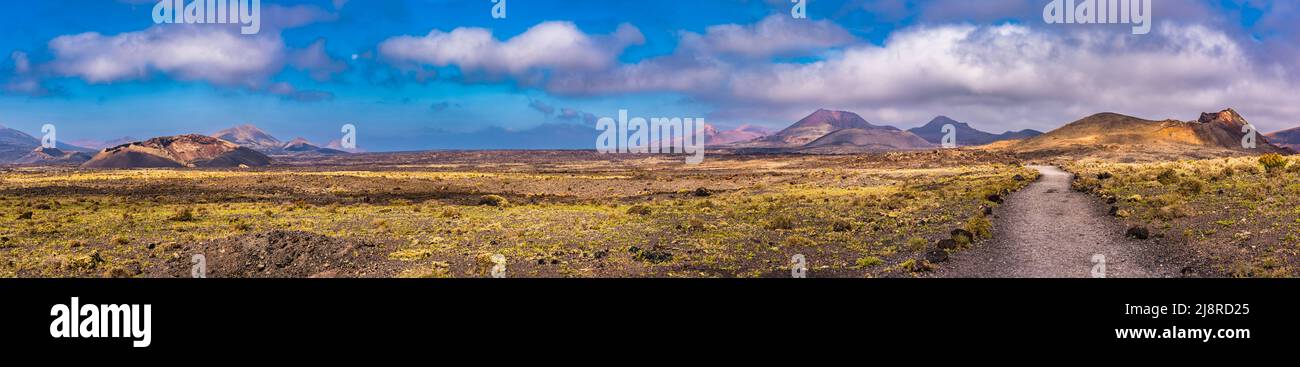 Panoramic view of the Volcan El Cuervo and the Volcan de Las Nueces, Los Volcanes Natural Park, Lanzarote, Spain Stock Photo