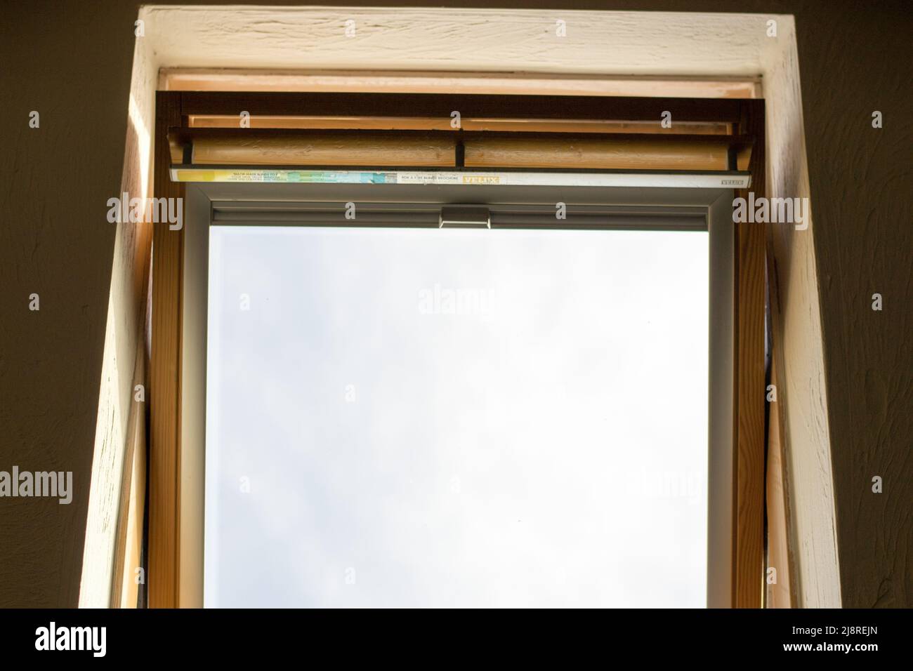 An open Velux window during the day time. Stock Photo