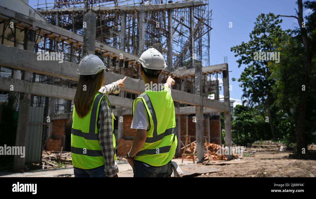 Inspectors and head engineer working together at construction site