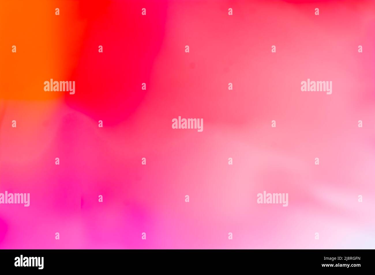 Multicolored bright background in orange, red, pink, tones. Abstraction with a smooth gradient. Backdrop Stock Photo