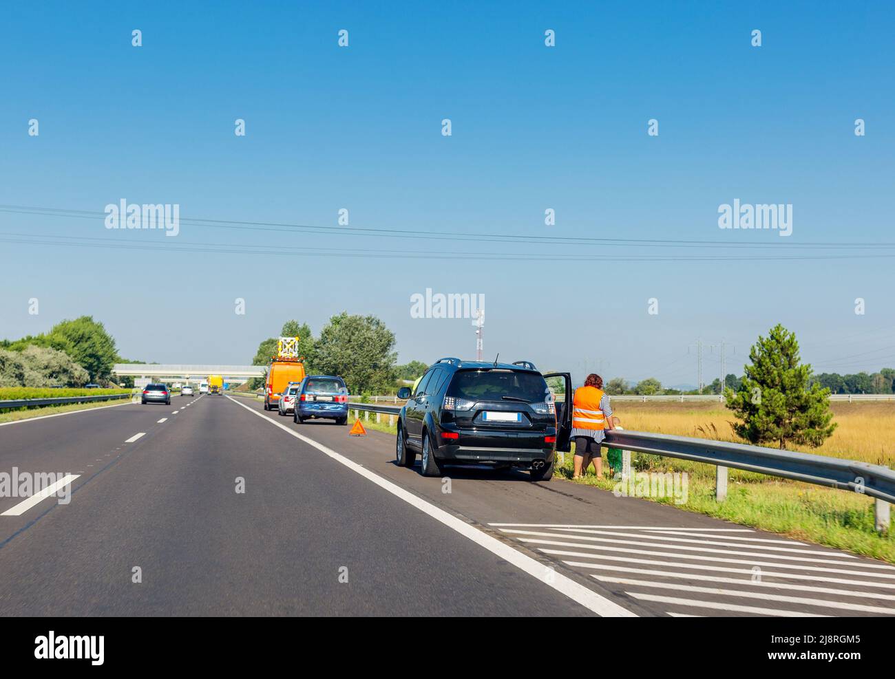 Two cars after collision on emergency stopping lane on roadside Stock Photo