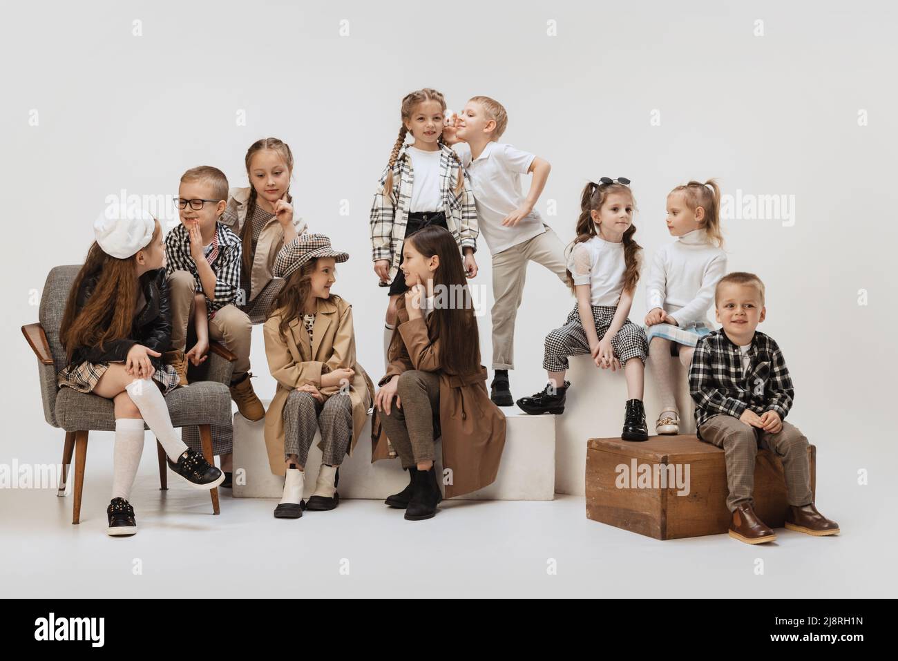 Friends. Group of beautiful kids, little girls and boys in modern outfits  posing on grey studio background. Beauty, kids fashion, education, happy  Stock Photo - Alamy