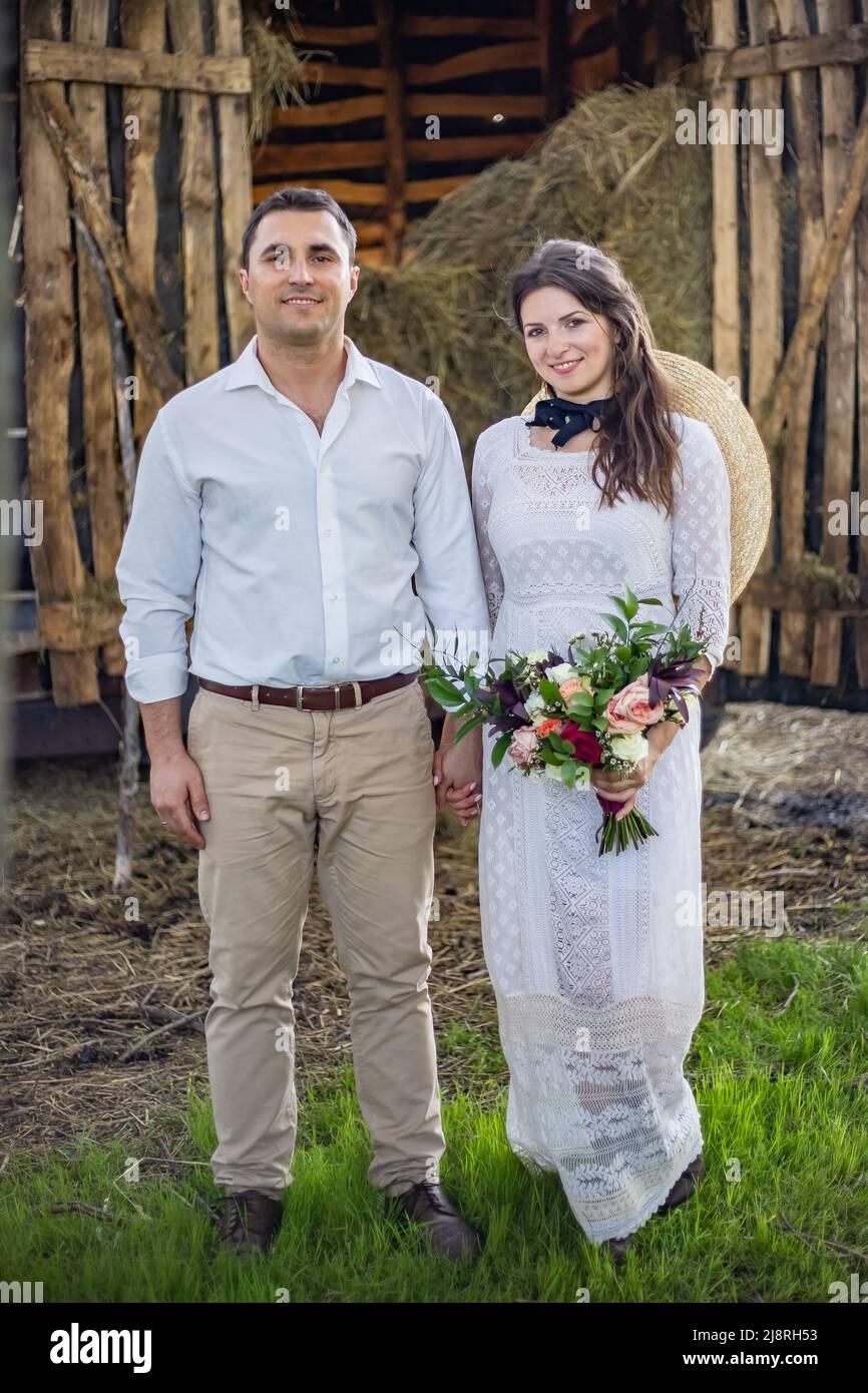 Loving groom in a black cardigan and a 