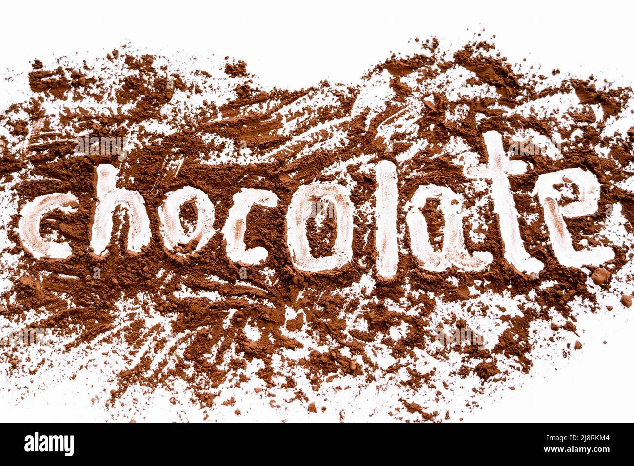 Top view of chocolate lettering in dry cocoa on white background Stock ...