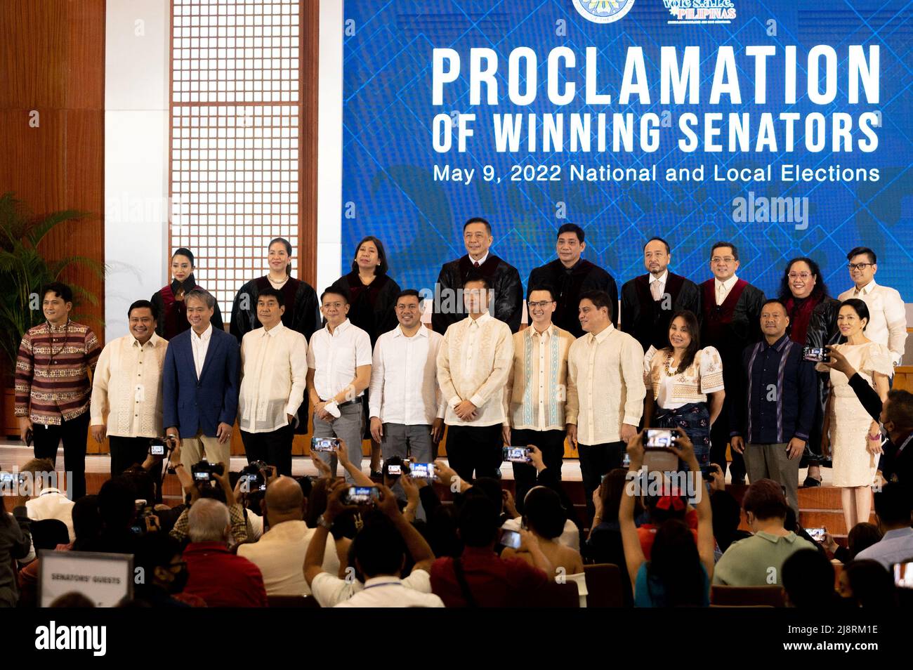 Winning Philippine senators pose for a photo during the proclamation