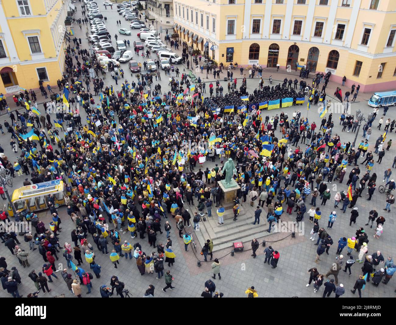 Odessa, Ukraine. 20th Feb, 2022. EDITOR'S NOTE : Image taken with drone.A large crowd of people holding Ukrainian flags is seen near the monument to Duke de Richelieu. Mass meetings in Odessa before the Russian-Ukrainian war. (Photo by Viacheslav Onyshchenko/SOPA Images/Sipa USA) Credit: Sipa USA/Alamy Live News Stock Photo