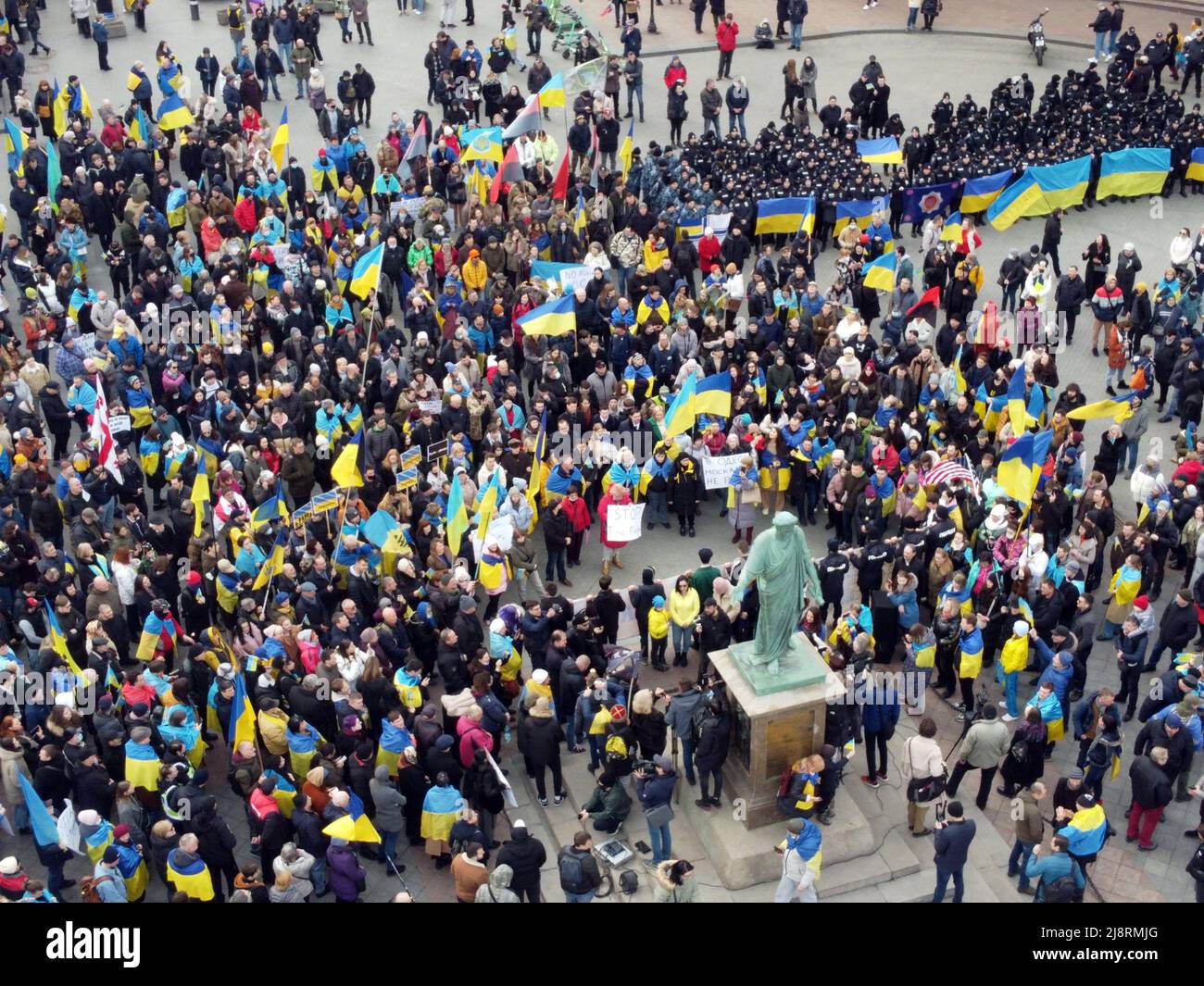 Odessa, Ukraine. 20th Feb, 2022. EDITOR'S NOTE : Image taken with drone.A large crowd of people holding Ukrainian flags is seen near the monument to Duke de Richelieu. Mass meetings in Odessa before the Russian-Ukrainian war. (Photo by Viacheslav Onyshchenko/SOPA Images/Sipa USA) Credit: Sipa USA/Alamy Live News Stock Photo