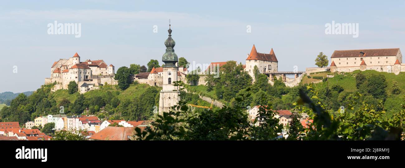 Burghausen, Germany - July 24, 2021: View on Burghausen Castle with the main castle (left), Georg’s Gate (Georgstor) and the Arsenal (Zeughaus). Stock Photo