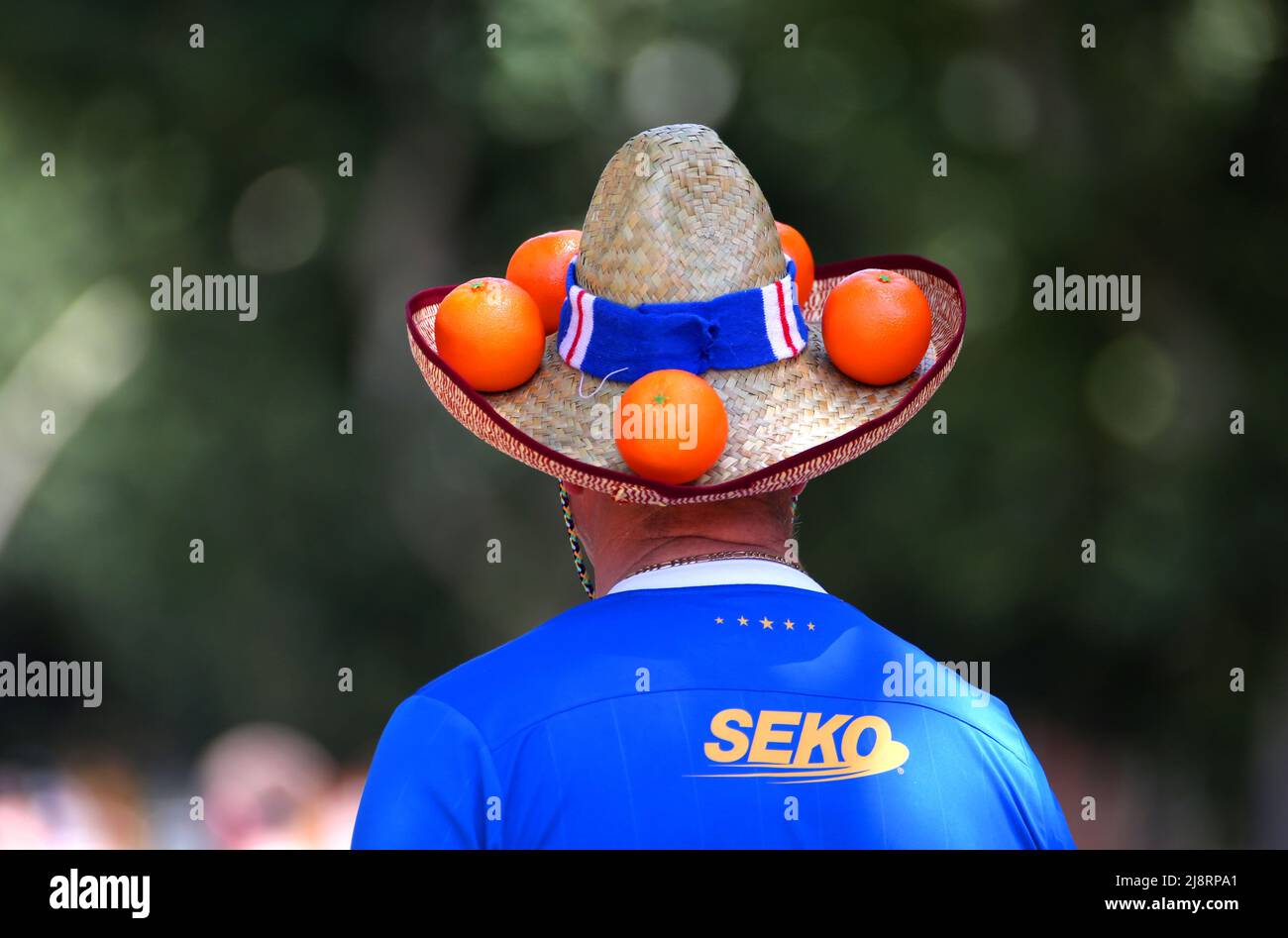A Rangers fan wears a hat decorated with oranges at the Alameda de Hercules ahead of the UEFA Europa League Final at the Estadio Ramon Sanchez-Pizjuan, Seville. Picture date: Wednesday May 18, 2022. Stock Photo