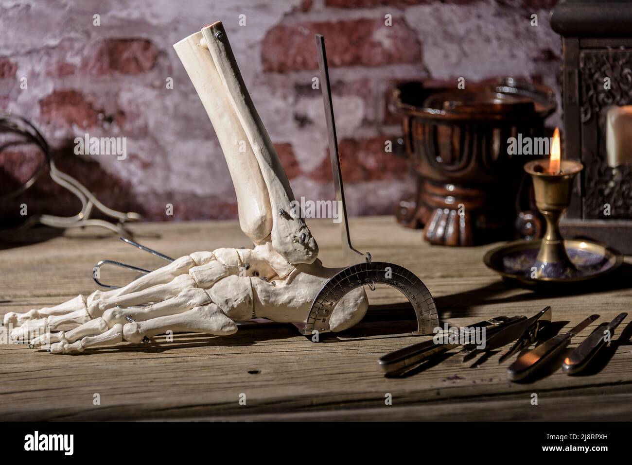 Vintage medical study desk. Traumatology and foot surgery study. Stock Photo