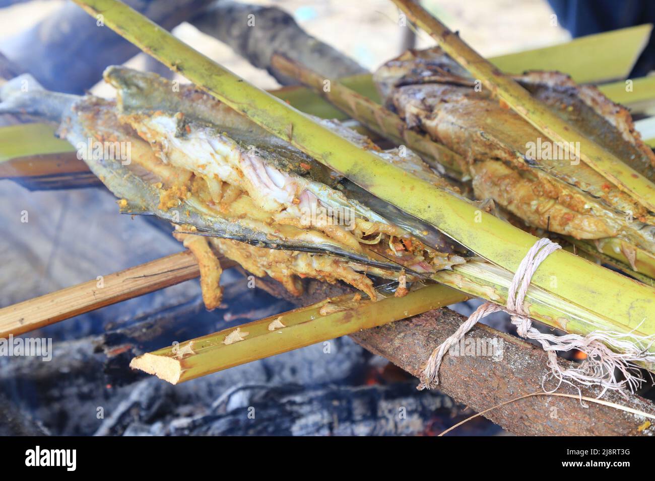 Grill fish by the beach covered with coconut leaves, the atmosphere ...