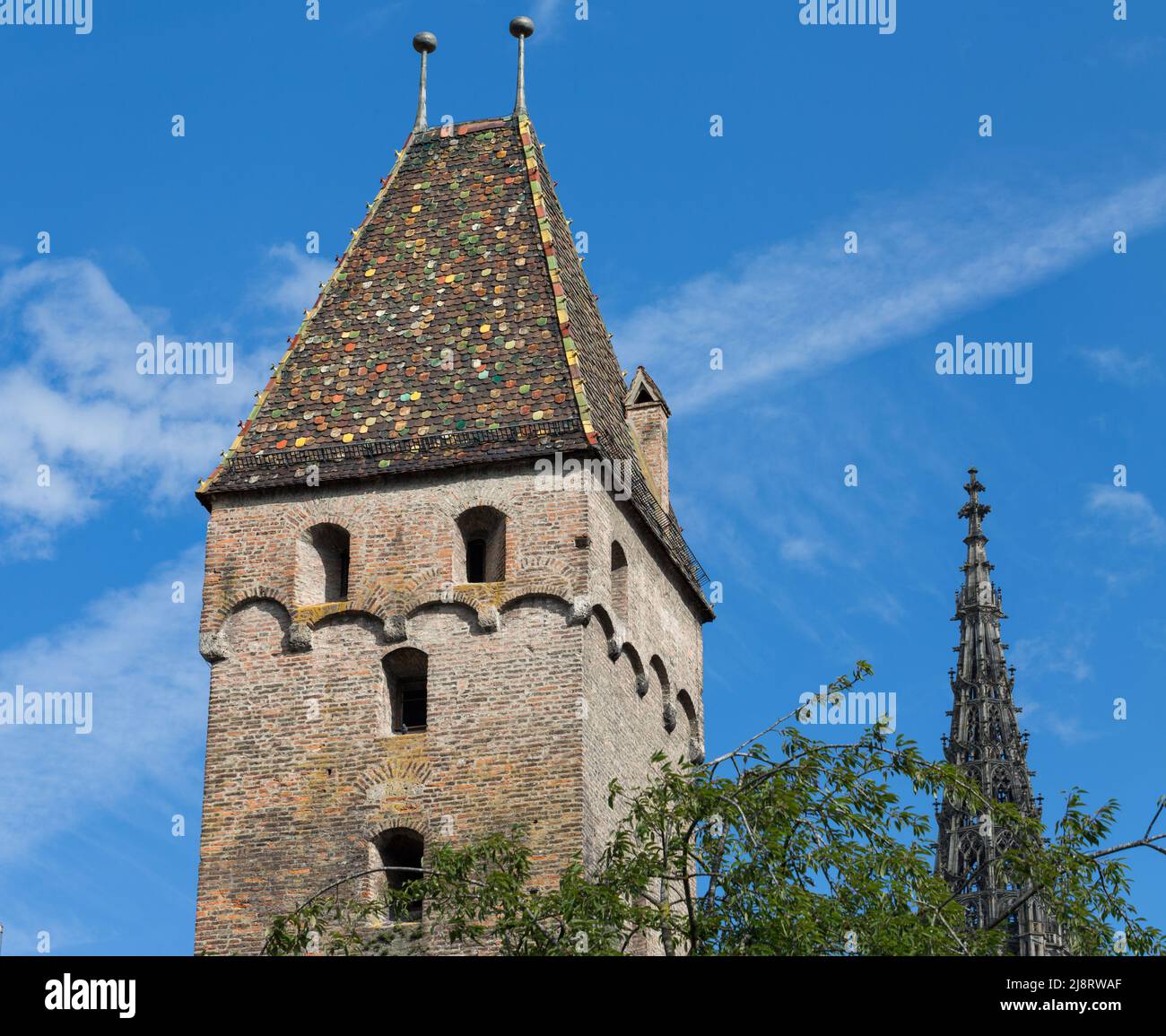 Ulm, Germany - Aug 8, 2021: View on the top of the Metzgerturm (historical tower). Part of the historical city center of Ulm. Stock Photo