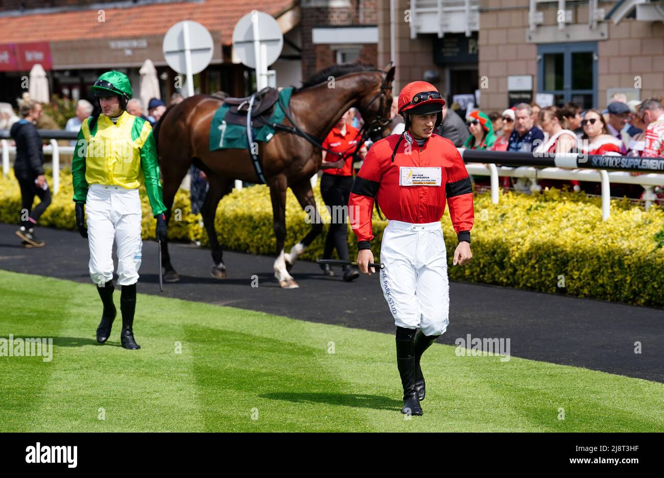 Jockeys Tommie M O'Brien (left) Tristan Durrell and in the parade ring ...