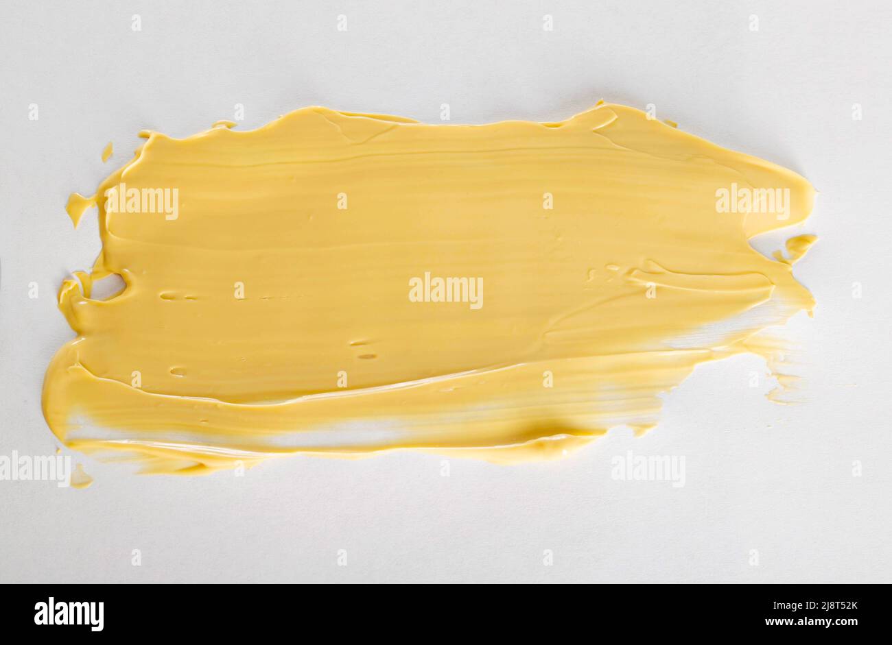 Yellow car polishing paste, closeup. Finishing car body polish. White