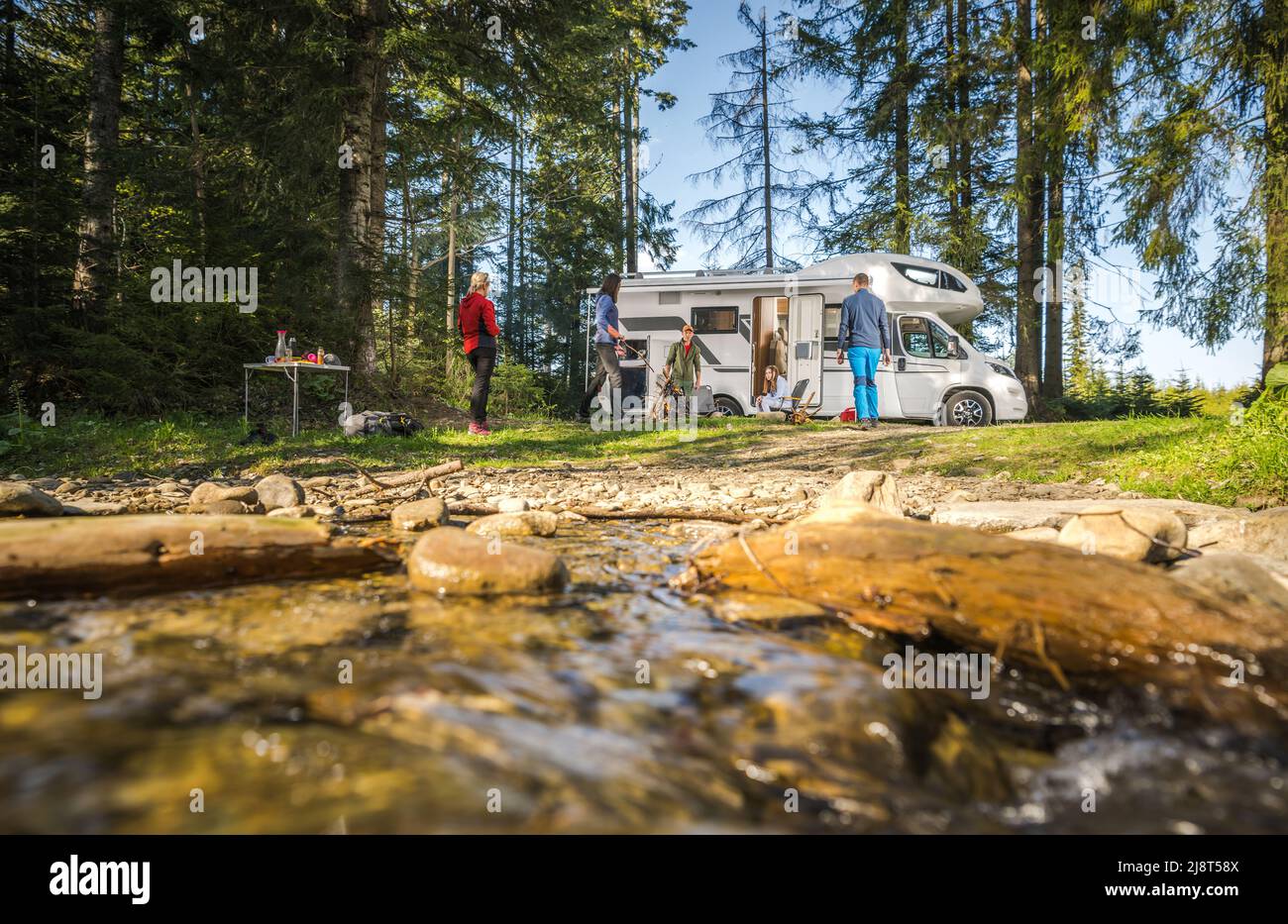 Five Caucasian People on Their Motorhome Road Trip Camping. Riverside ...